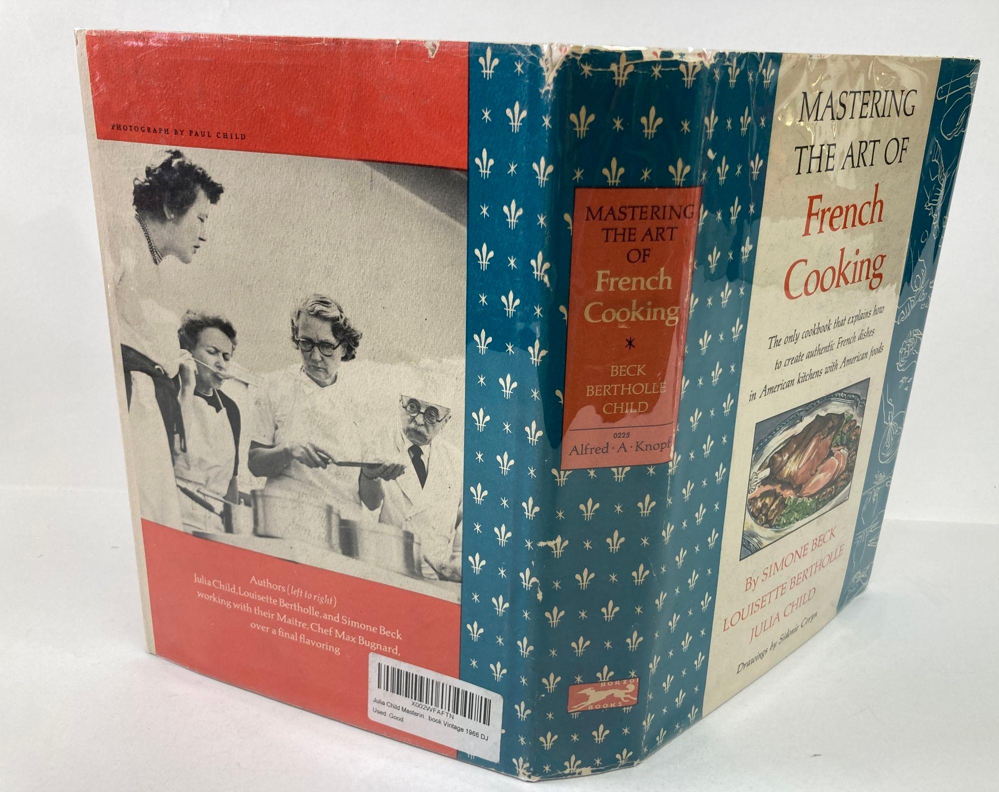 Julia Child MASTERING THE ART OF FRENCH COOKING VOL. ONE
New York: Alfred A. Knopf. First Publishing 1961; Sixth Printing 1964. Hardcover. 
Autographed from Maitland Martinez to Bob Mausteeler March 21st 1965
Condition: Few small open tears along