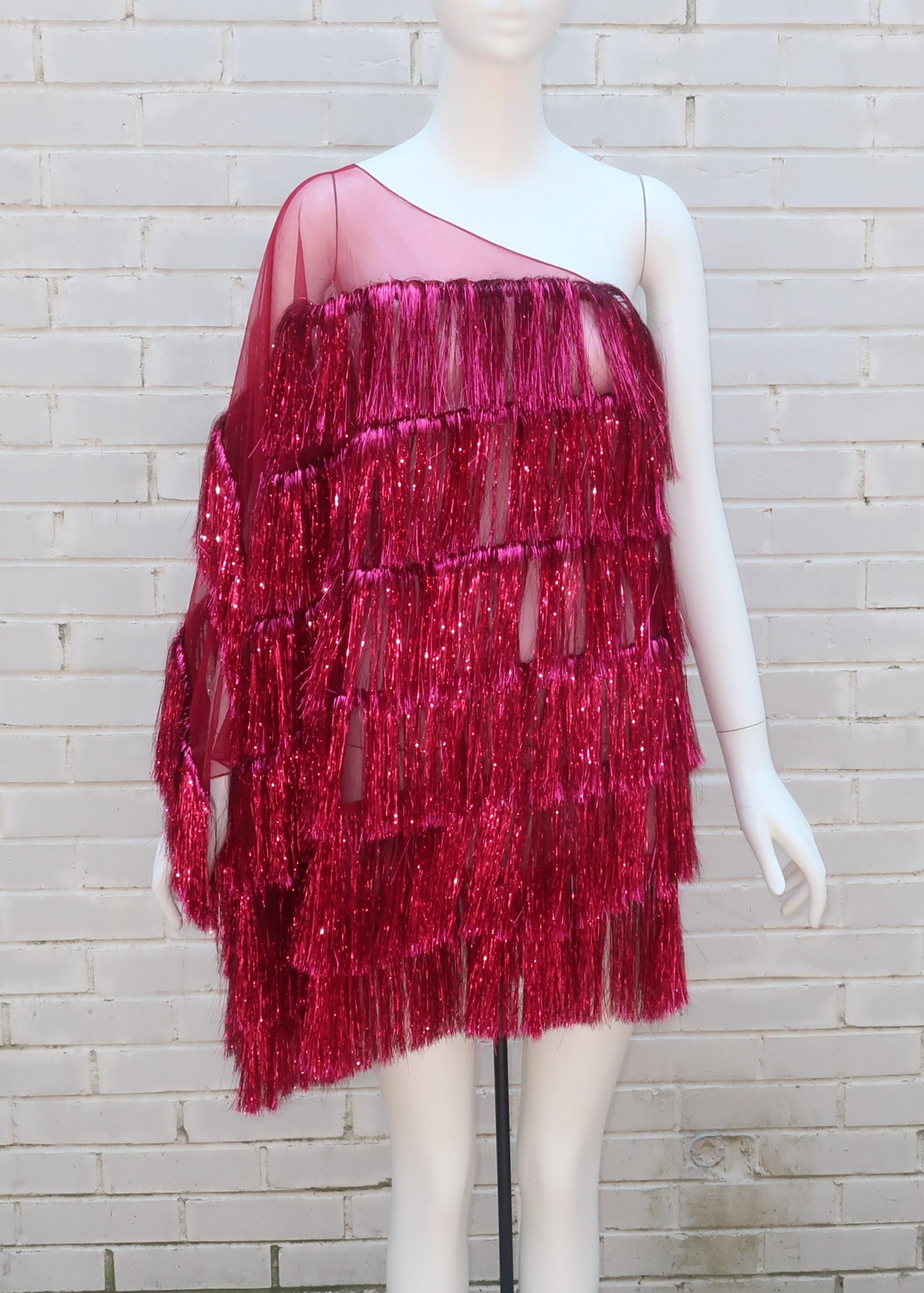 A fabulous 'Frou Frou' tinsel fringe dress by UK designer, Julia Clancey.  Clancey describes this style as pure party wear and it is definitely a party waiting to happen whether you are hostessing at home or going out on the town.  The one