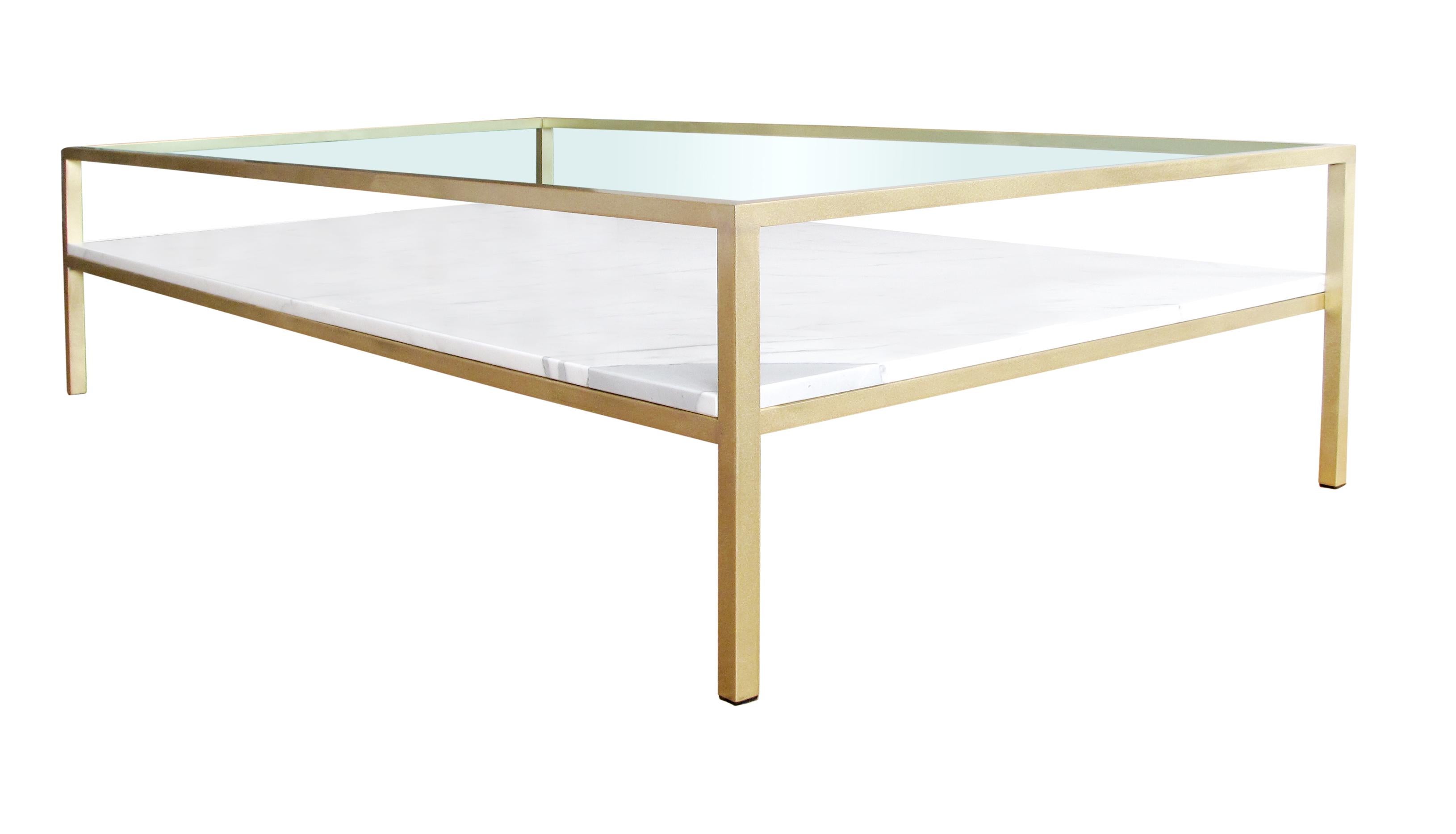Brass or stainless cocktail table with stone base and glass top. Available in a wide range of materials, finishes and sizes. Can be customized to accent any interior. Pricing varies based on choice of materials and finishes.