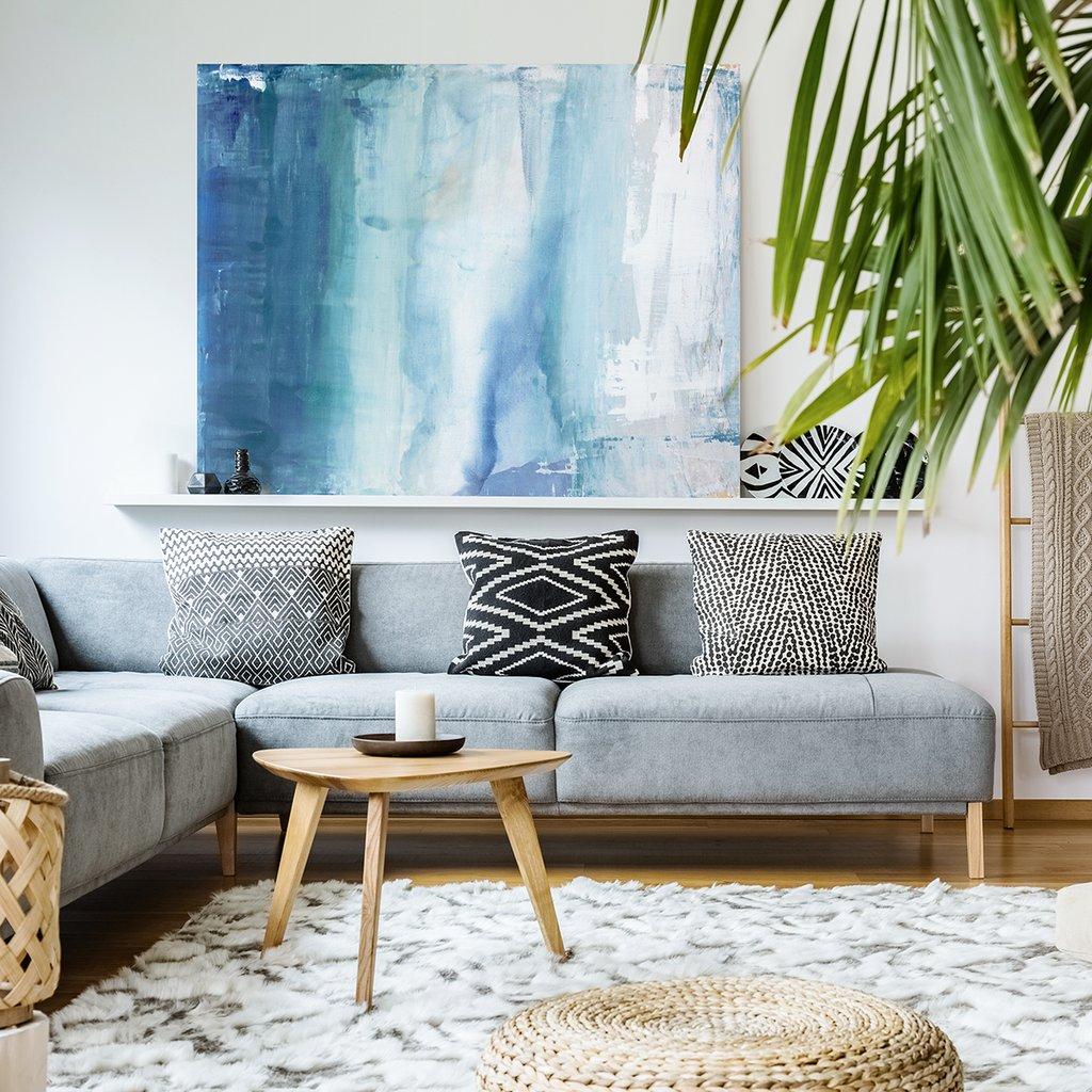 This coastal abstract statement painting Julia Contacessi features a beautiful blend of cool blues, greens, greys, and whites, creating a soft aesthetic the artist equates to feeling the rise and fall of a solar tide. When the sun, moon, and earth