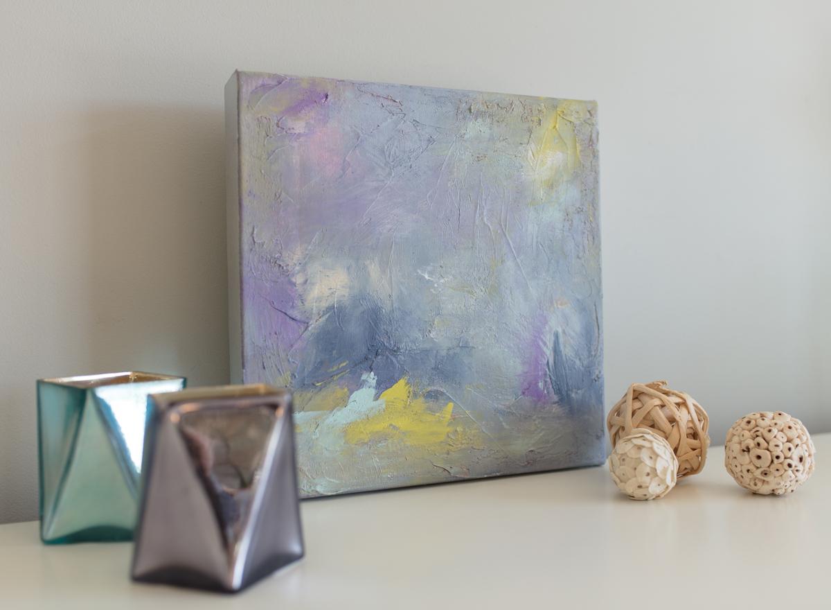 This small original abstract painting by Julia Contacessi is is a lively swirl of whimsical colors. Varying shades of violet swirl around the canvas with pops of yellow and grey. The playful colors come together to create a happy and unique palette.
