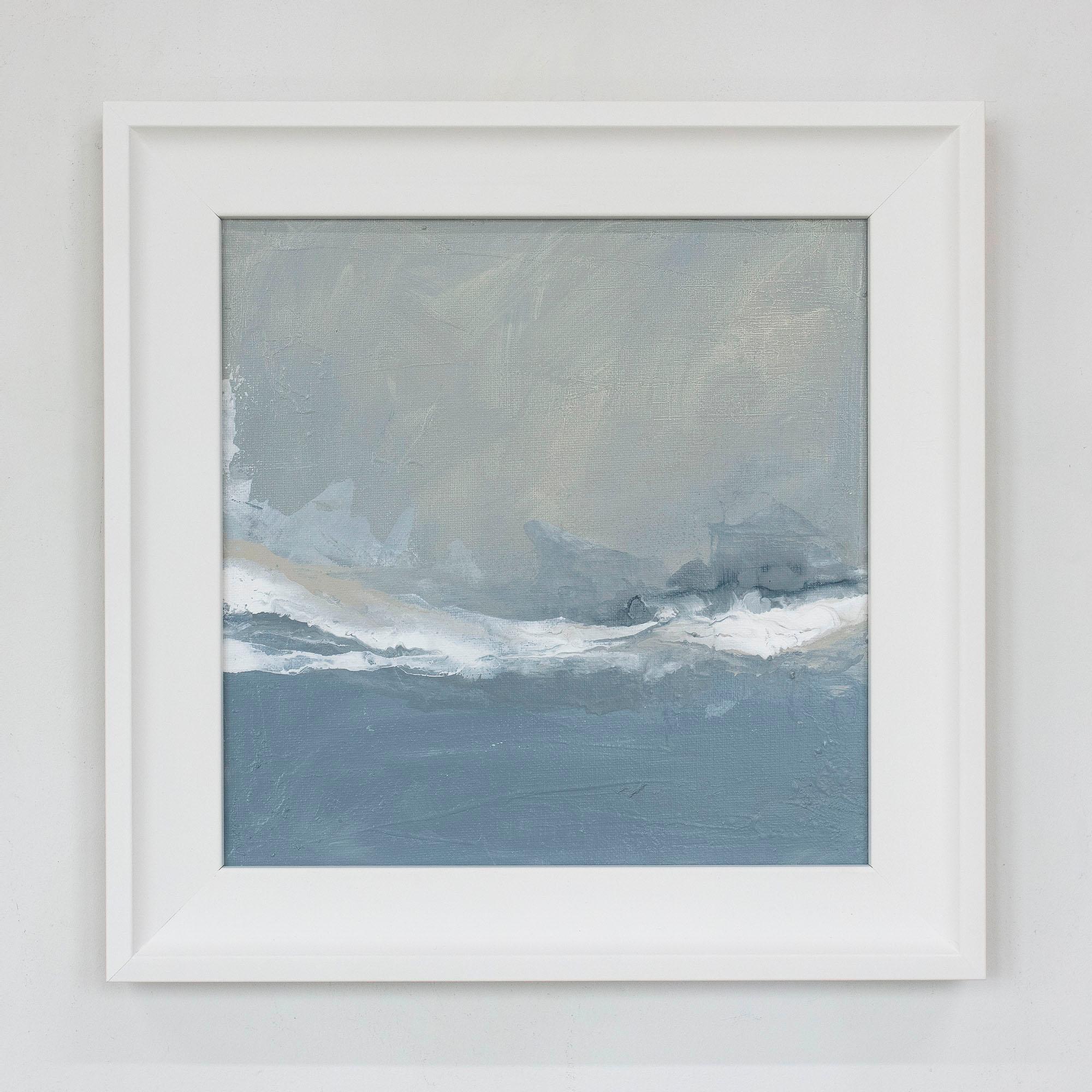 These two small framed abstract paintings by Julia Contacessi feature a cool blue-grey palette with a wash of a white accent that flows horizontally through the center of each composition. Each painting in this diptych measures 10