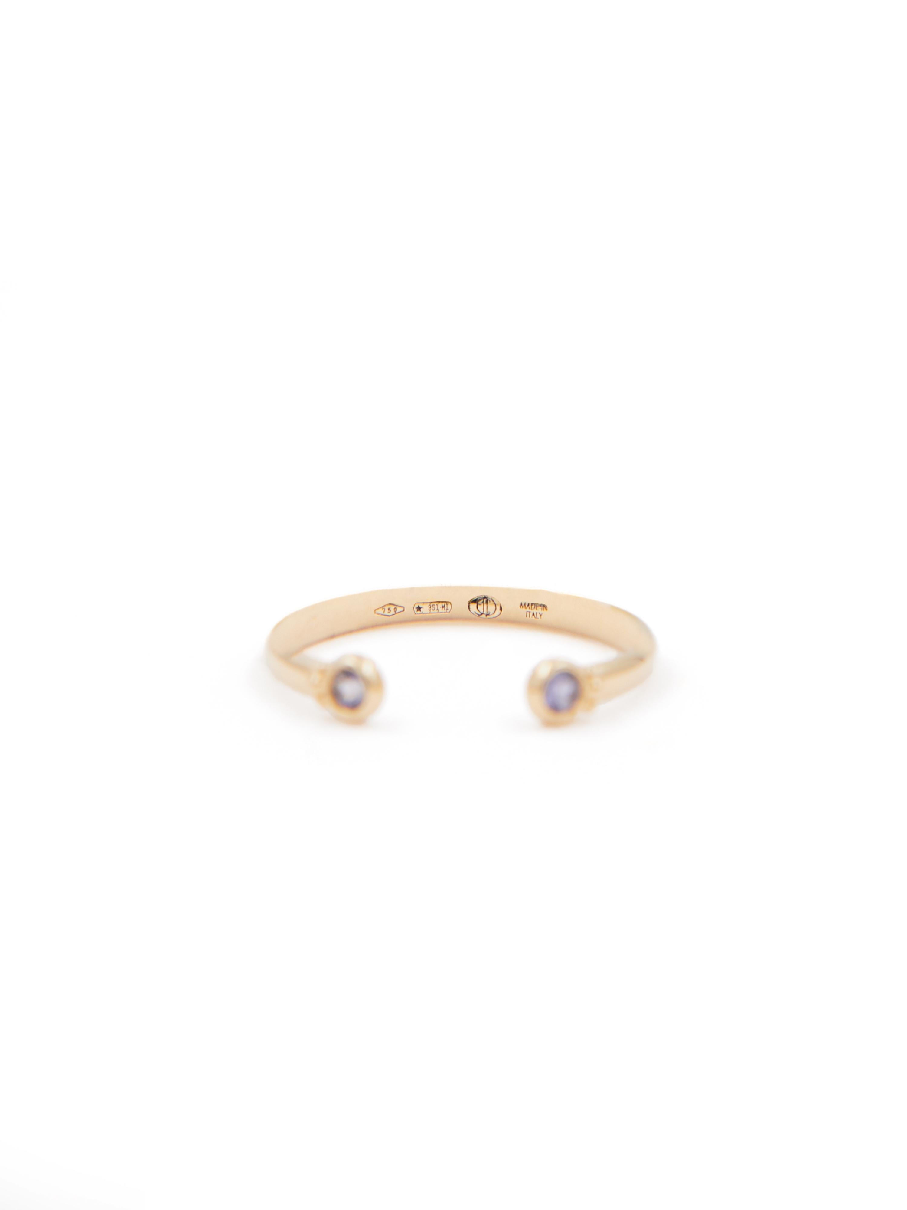 18 karat yellow gold open stacking ring set with two round iolite stones.  

This ring is available in three sizes (Italian sizes 12, 14 and 16 / US sizes 6, 6 3/4 and 7 1/2) 
 
Perfect worn alone or for stacking with the other stacking rings in the