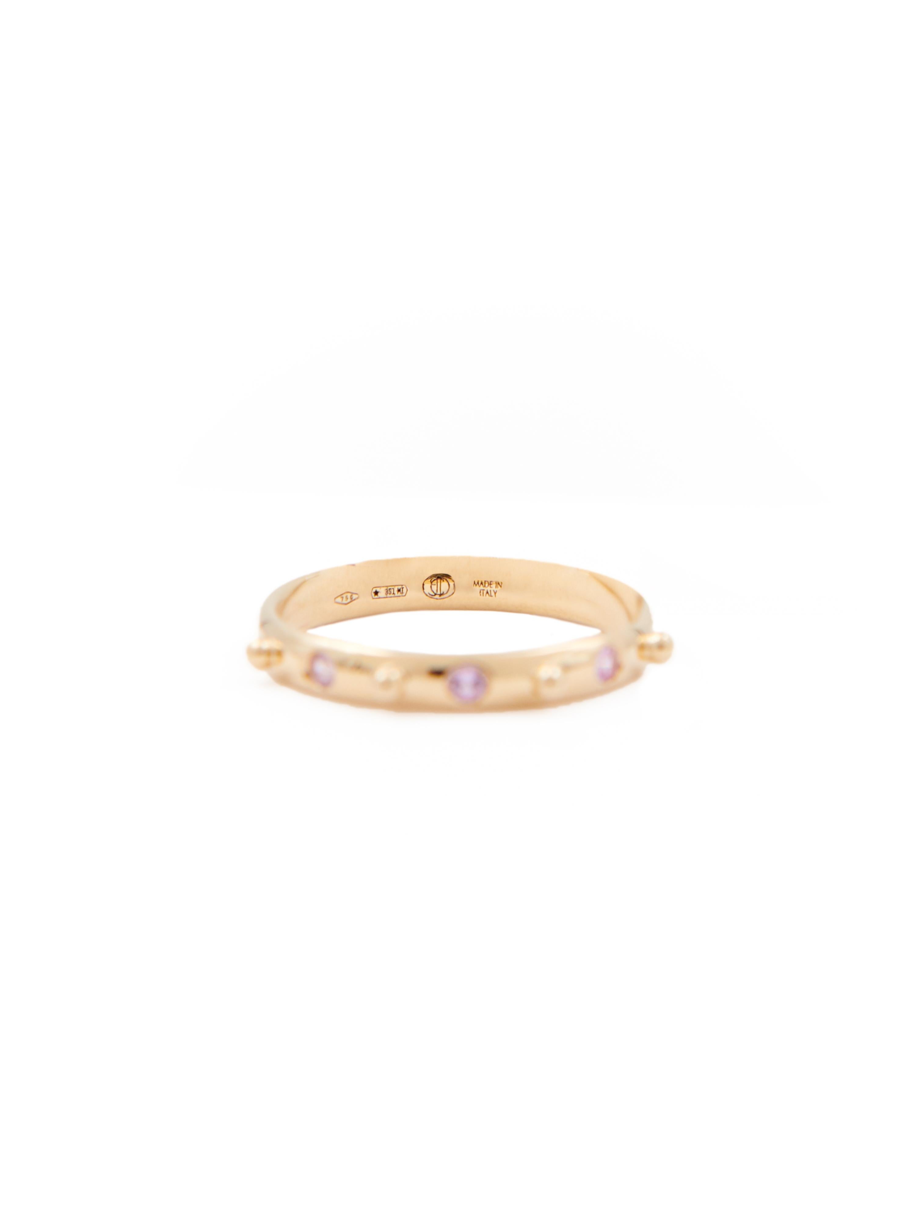 18 karat yellow gold stacking ring with three pink sapphires.  
  
This ring is available in three sizes (Italian sizes 12, 14 and 16 / US sizes 6, 6 3/4 and 7 1/2)

Perfect worn alone or for stacking with the other stacking rings in the Mezzanotte