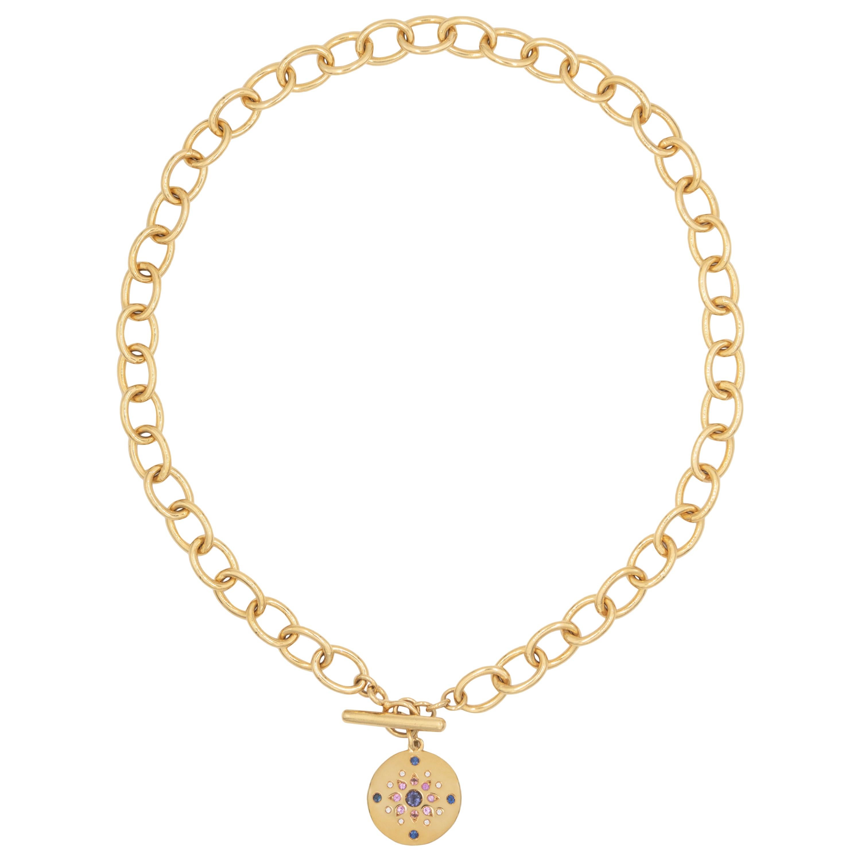 18 karat yellow gold necklace with round disc pendant and choker length large chain. The pendant is set with 21 gemstones including a central aquamarine (0,16-carat) and diamonds (0,33-carat). 
  
The length of the chain for this necklace is 41 cm