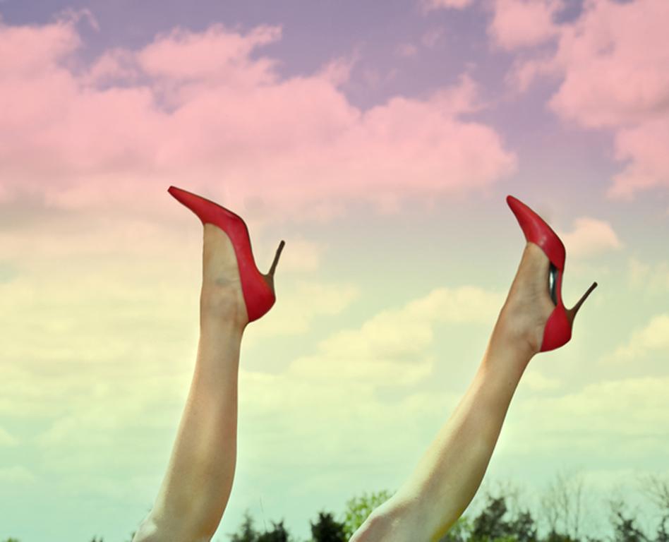 Country Quarantine - Red high heel legs rising out of bluebonnet field landscape - Photograph by Julia McLaurin