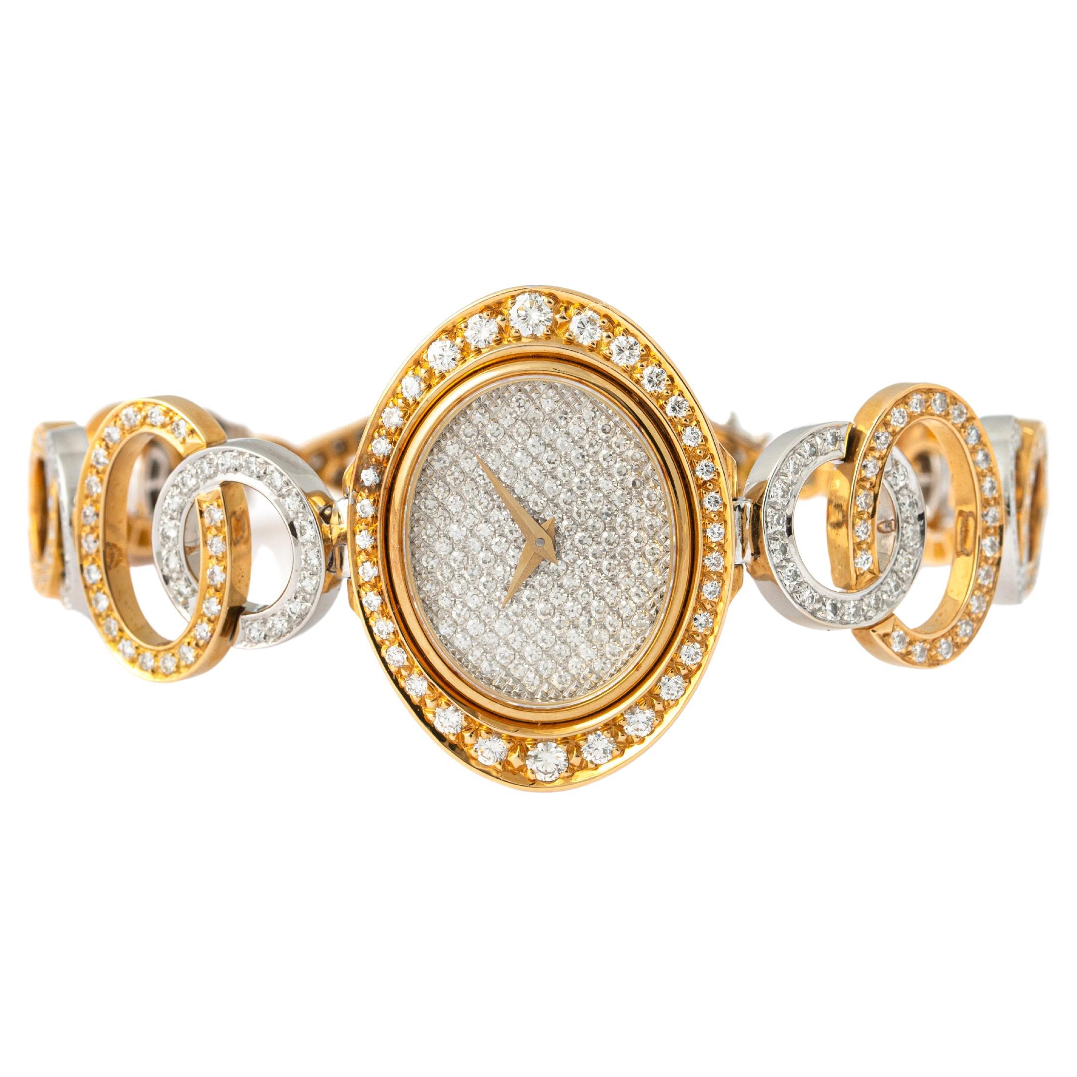 Julia-Plana and Simon Shlegel Diamond, yellow and white gold 18K wristwatch.
The mark 