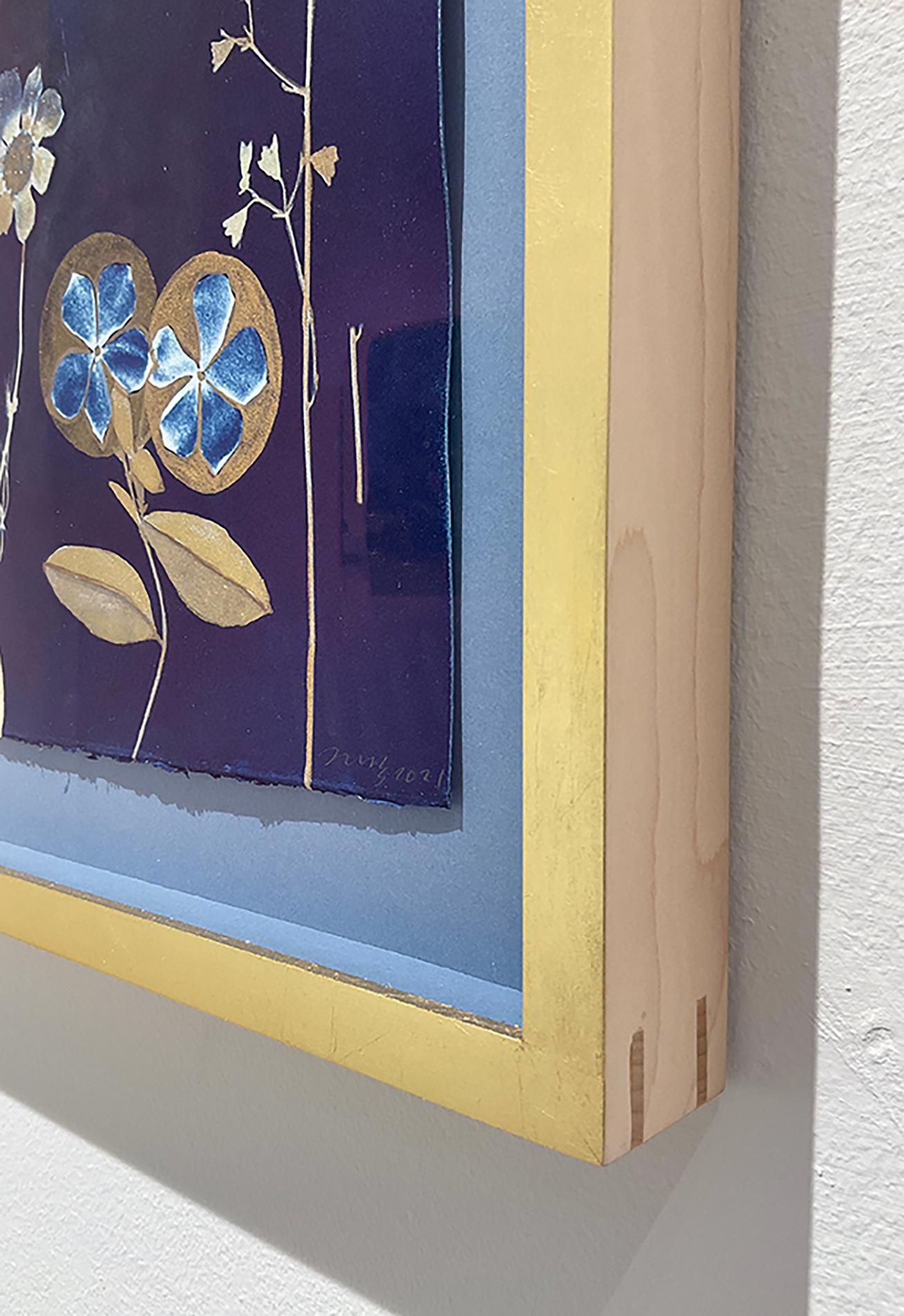 Figurative Still Life painting of pale blue and gold flowers on an indigo cyanotype background 
