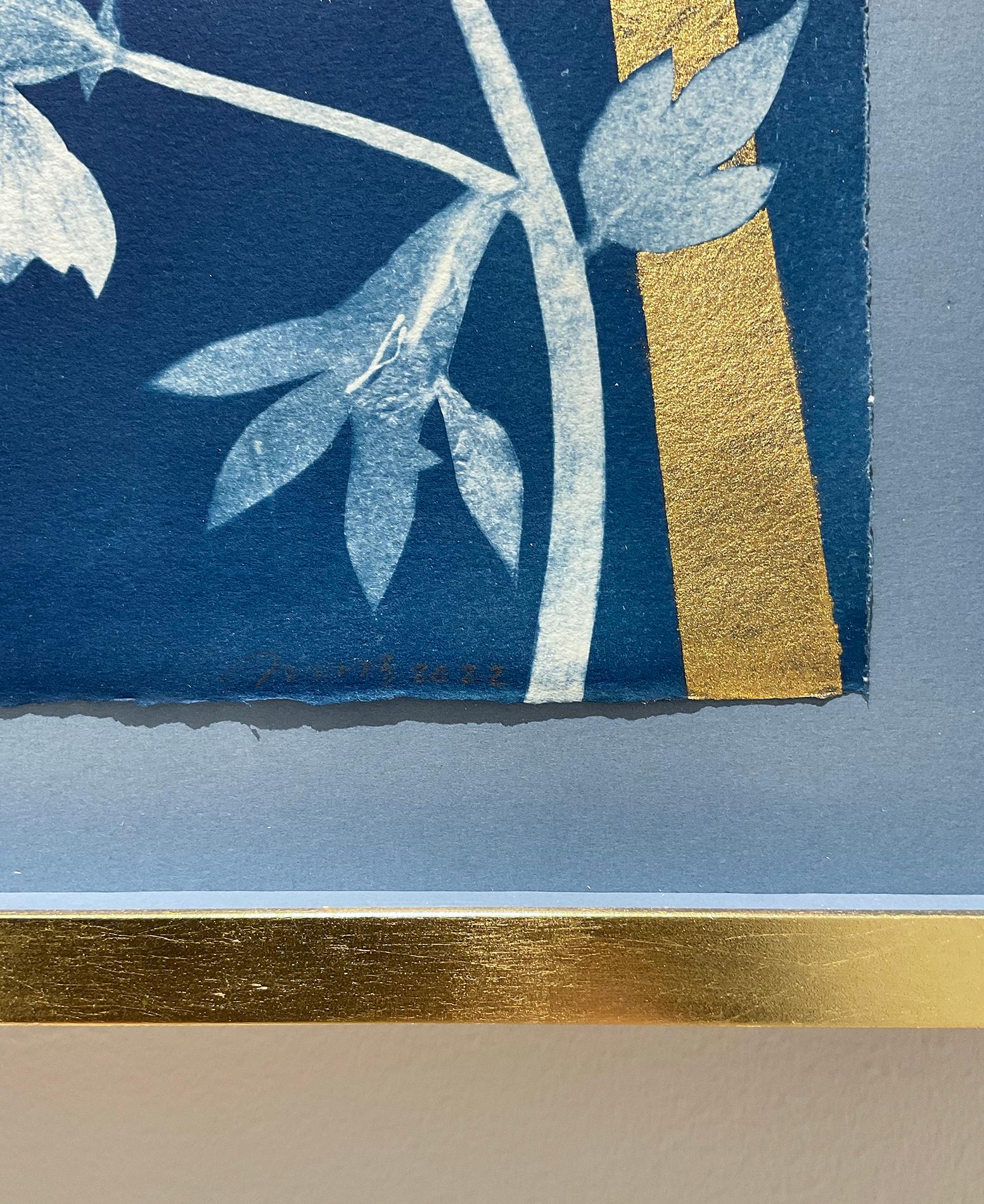 Figurative Still Life painting of pale blue flowers and butterflies with a gold sun on an indigo cyanotype background 
