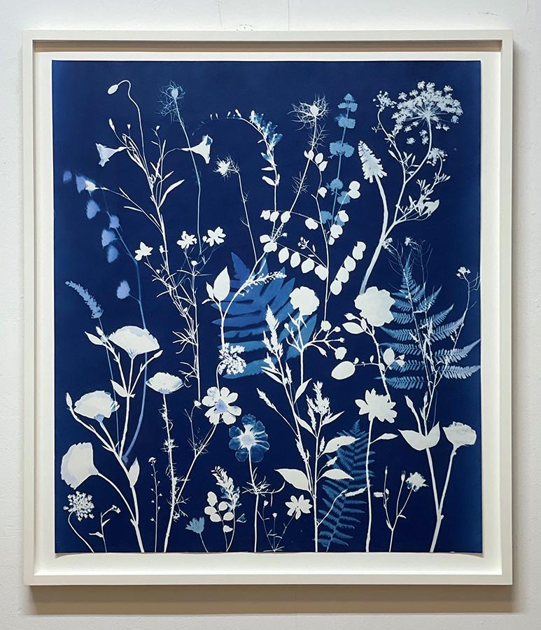 Figurative Still Life painting of pale blue and white flowers on an indigo cyanotype background 
