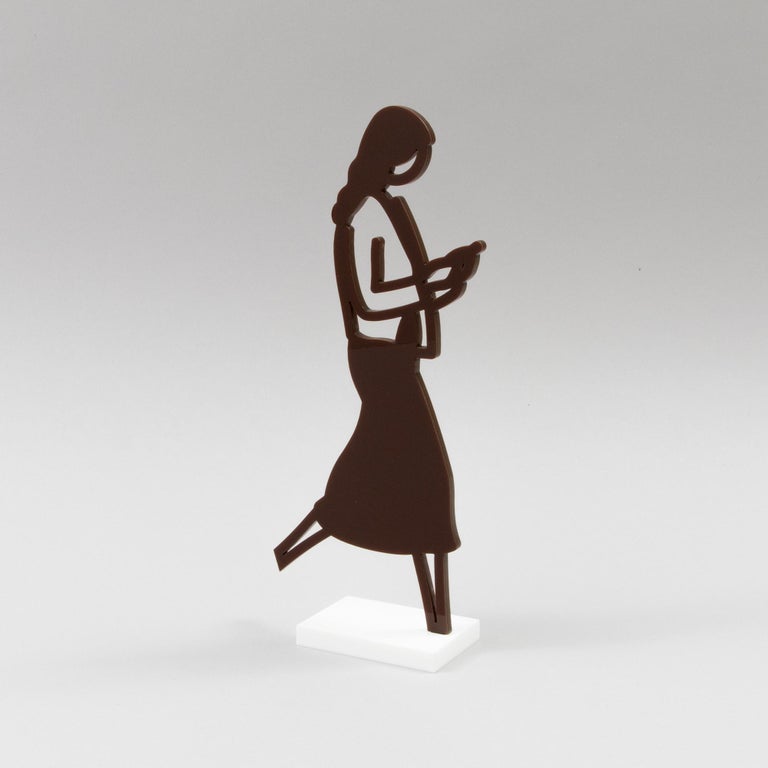 Julian Opie (British, b. 1958)
Female Walker (Brown), 2020
Medium: Laser cut acrylic, two-part statuette 
Figure measures: 24.3 x 12 x 0.5 cm
Base measures: 7.5 x 5 x 1 cm
Edition size: Open edition, not signed
Condition: Mint, sold in its original