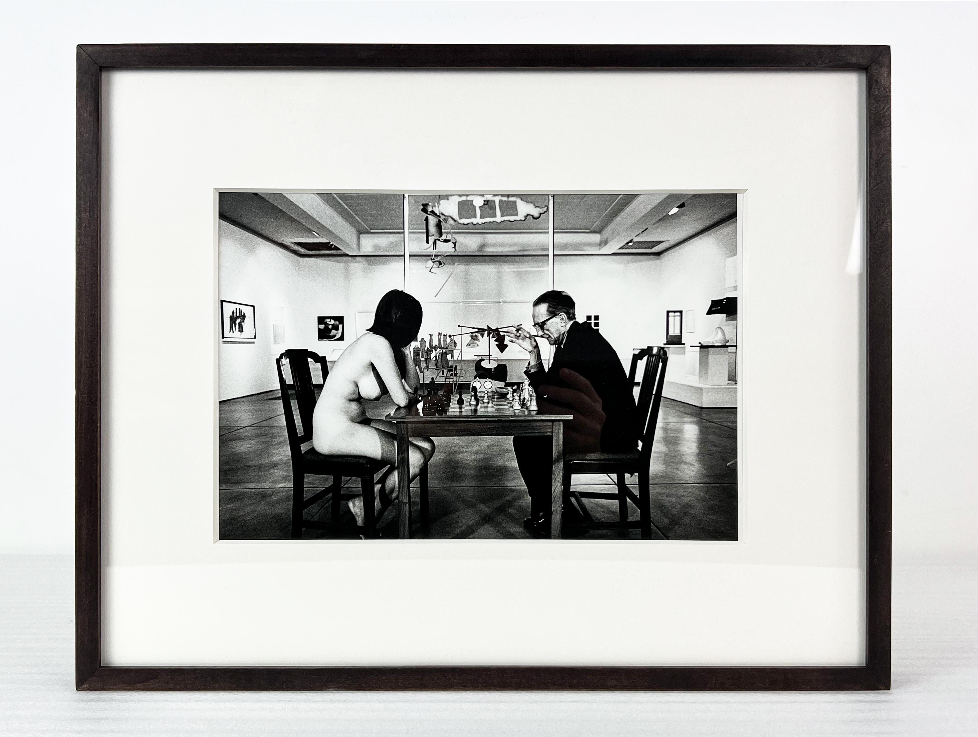 Eve Babitz and Marcel Duchamp playing chess during Duchamp's Pasadena Art Museum - Photograph by Julian Wasser