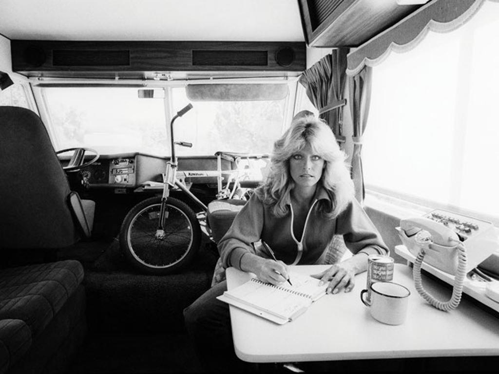 Julian Wasser Black and White Photograph - Farrah Fawcett writing in her journal, 1976