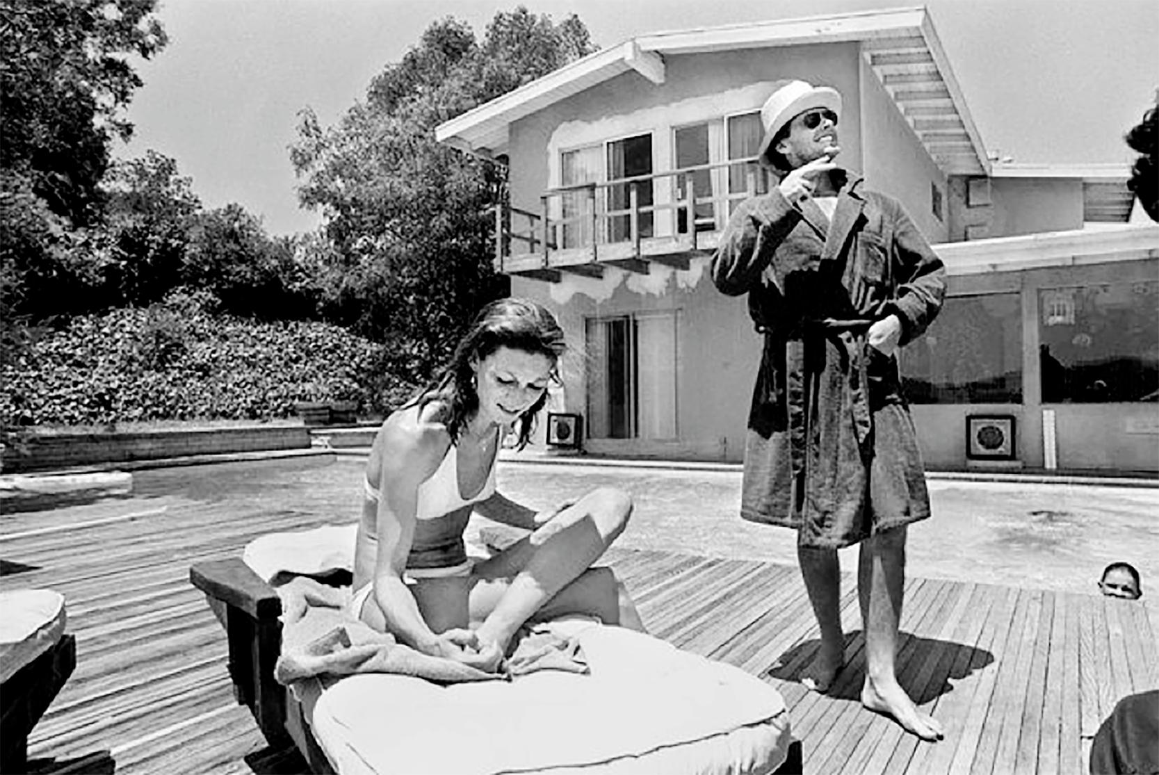 Julian Wasser Black and White Photograph - Jack Nicholson and Anjelica Huston by the pool, 1974