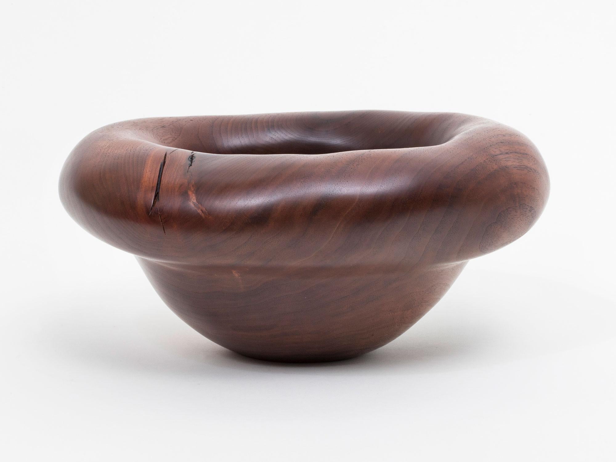 Hand carved walnut bowl sculpture by Oregon based artist Julian Watts.

Julian Watts was born and raised in San Francisco, and now lives and works in Alpine, OR. He has shown work internationally at the FOG Fair, Design Miami, The London Design