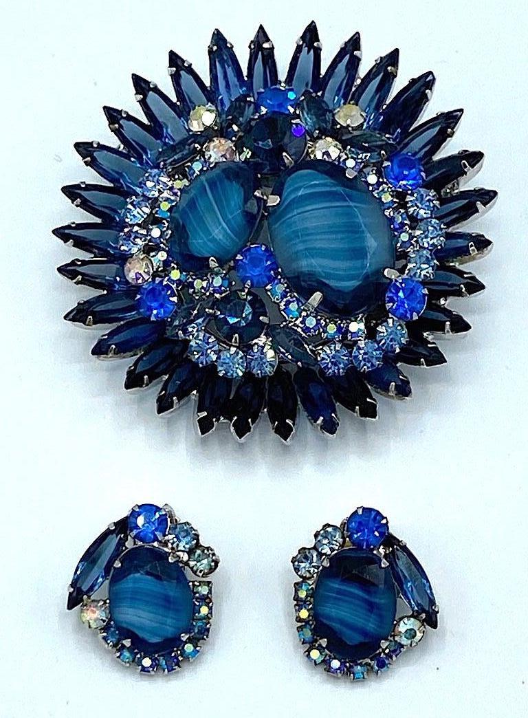 A magnificent Julianna crystal and rhinestone brooch with matching earrings from the 1960s. The Juliana line of jewelry was produced by DeLizza & Elster, a manufacturer of costume jewelry for many fashion companies including Kenneth Jay Lane, Hattie