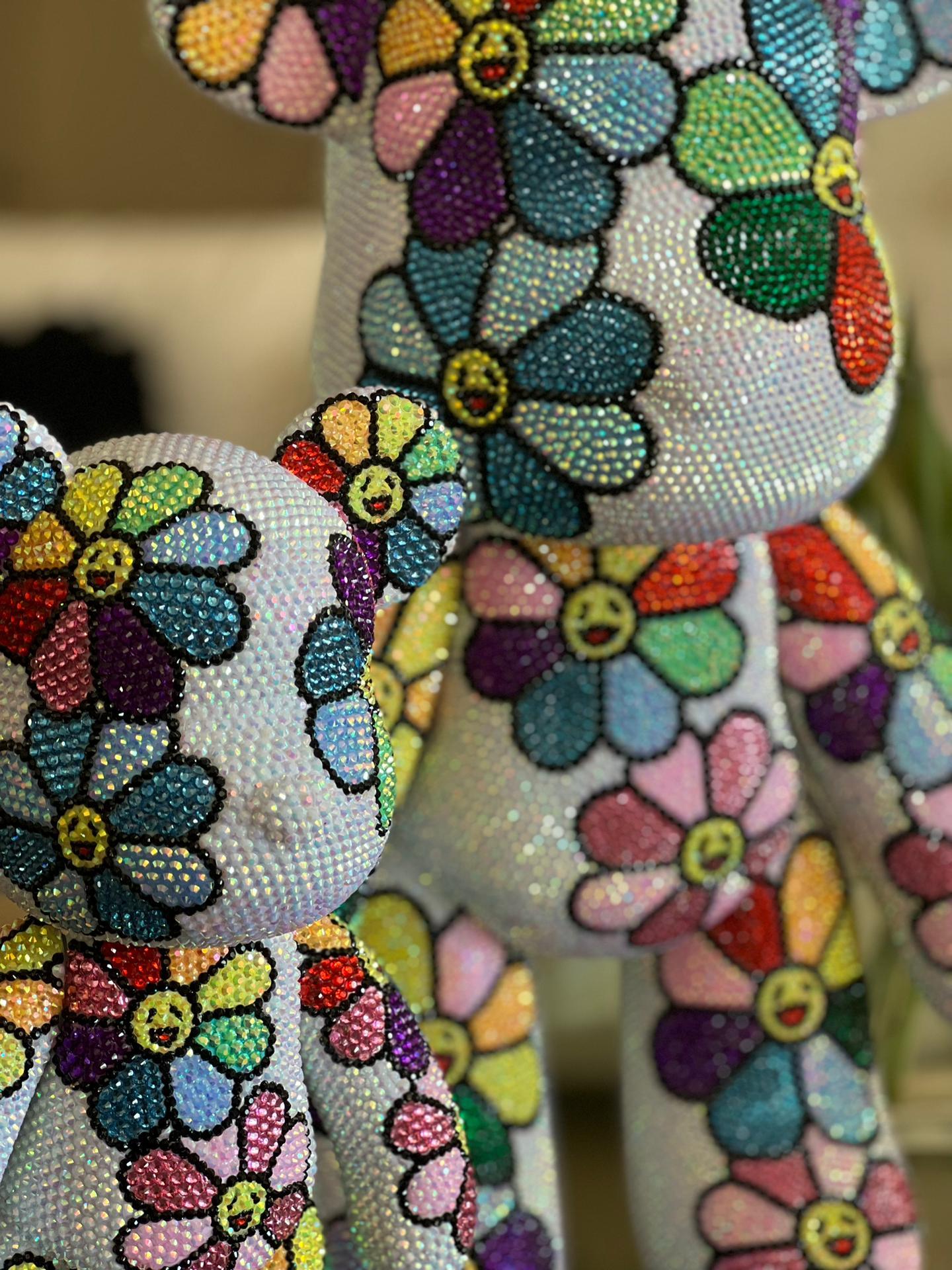 Medium: Resin, Acrylic Paint & Rhinestone Crystals.

Edition: Limited edition of 8 semi identical bears 
Additional information: NFT of the Blooming bear included 

Information: Juliana Del Burgo, artistically known as ‘Burgo’, was born in Cascais,
