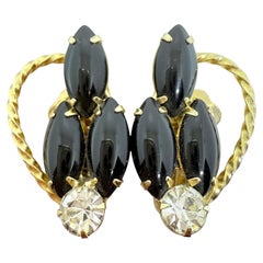 Orecchini a clip di Juliana Delizza 
Elster in vetro nero tono oro