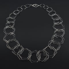 Used "Tenitic Necklace  Long " a contemporary, fine gauge stainless steel necklace