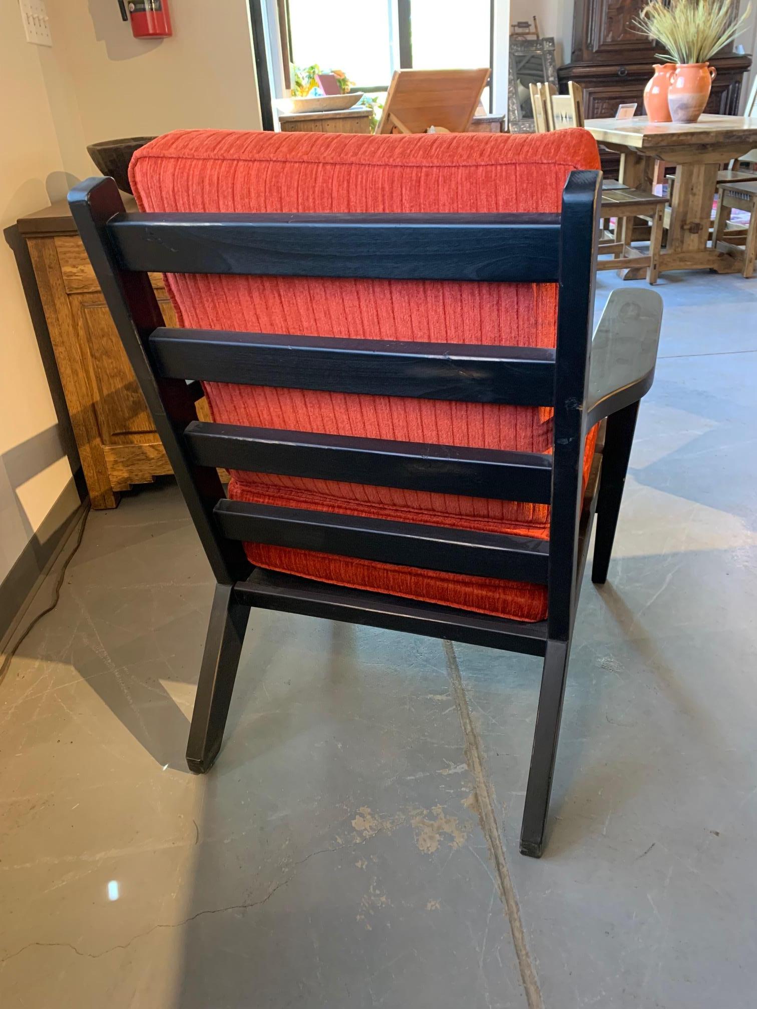 Ernest Thompson Custom Julie Lounge Chair.
Made in Alder with a black scraped finish.
Red upholstered seat and back cushion.

This is a showroom floor model in perfect condition.