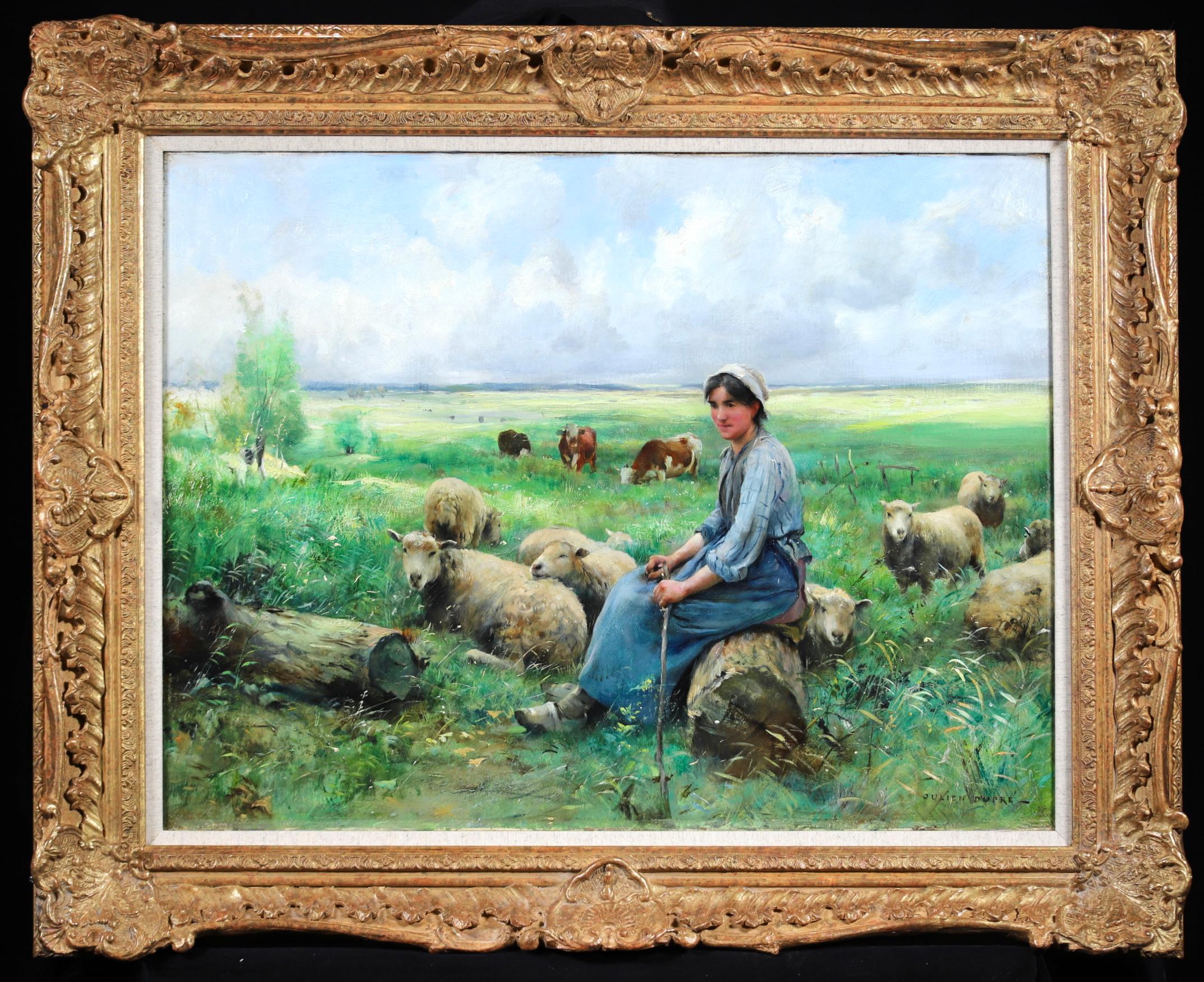 Signed impressionist oil on canvas figure and animals in landscape by French painter Julien Dupre. The work depicts a shepherdess resting on a log as her sheep graze in the green meadow. Cows can be seen in the distance. Captivating in its scene, a