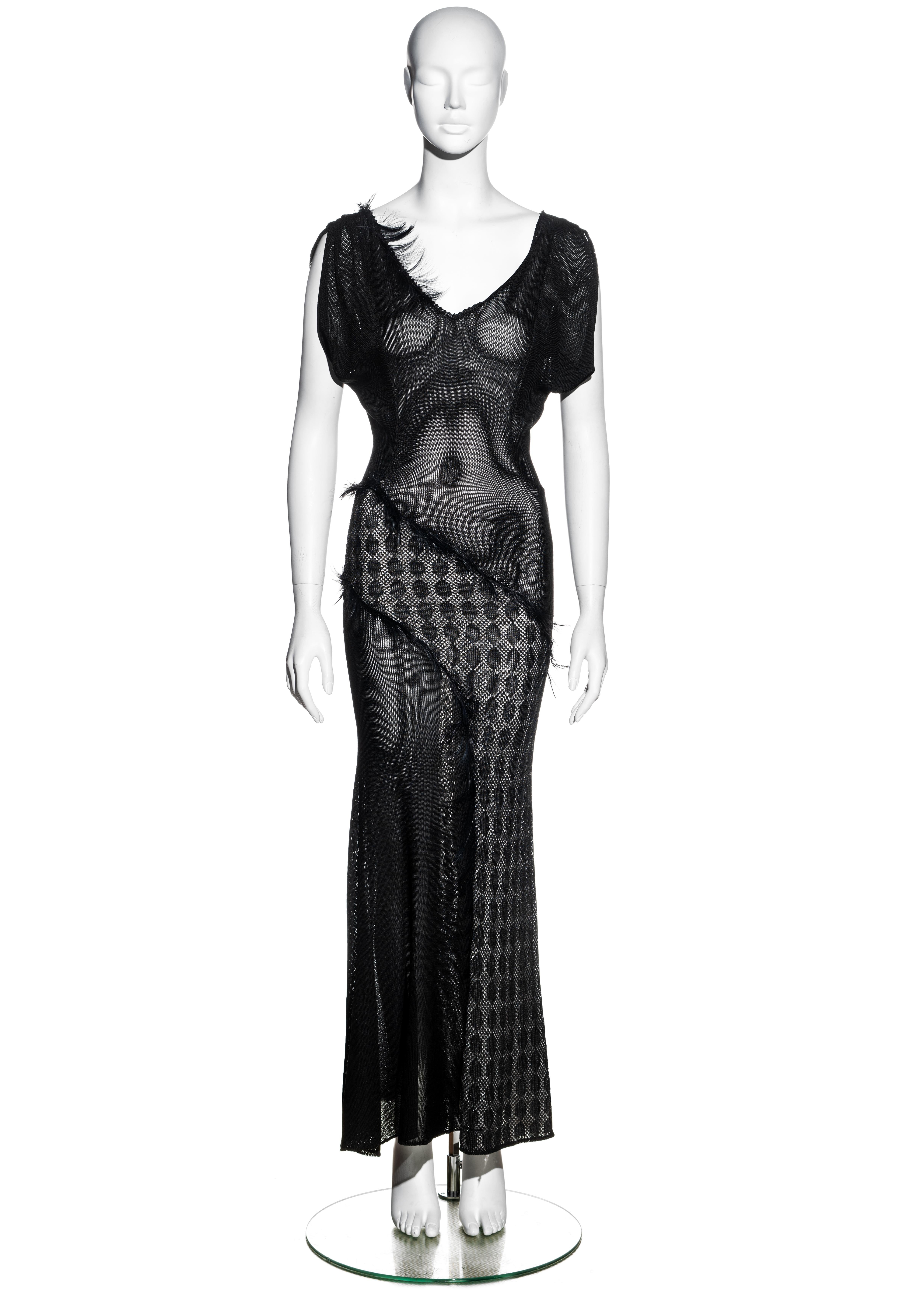 ▪ Julien Macdonald black acetate knit evening dress
▪ Bias cut 
▪ Black feather trim 
▪ Low back
▪ Check patterned panel with metallic silver underlay 
▪ Size Extra Small 
▪ Fall-Winter 1998