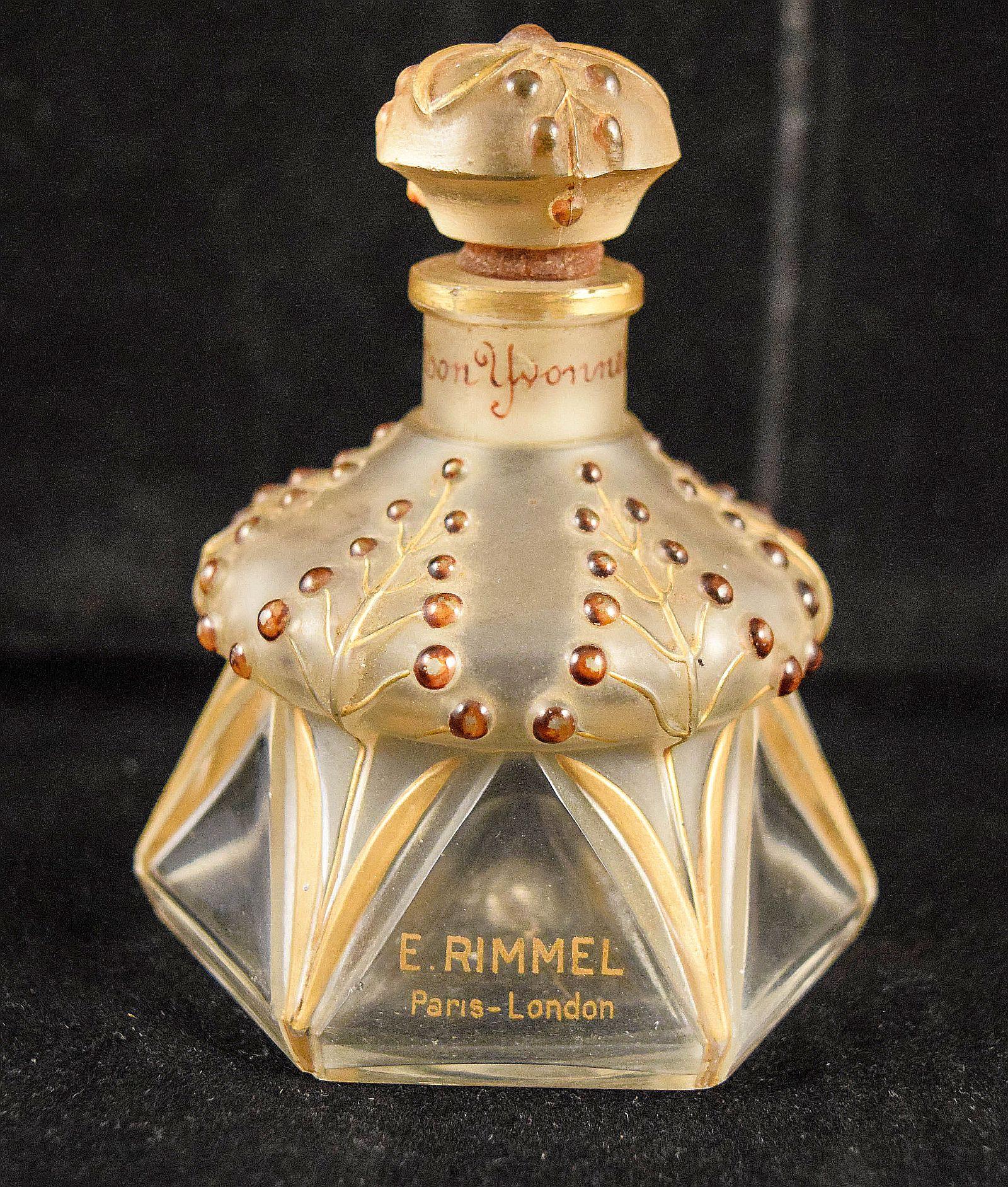JULIEN VIARD PERFUME BOTTLLE FOR RIMMEL
An YVONETTE glass perfume bottle circa.1924 hexagonal section relief moulded and gilded with stylized g.
This is a very rare example I haven't seen one in auction catalogs
in the last twenty years.
It is in