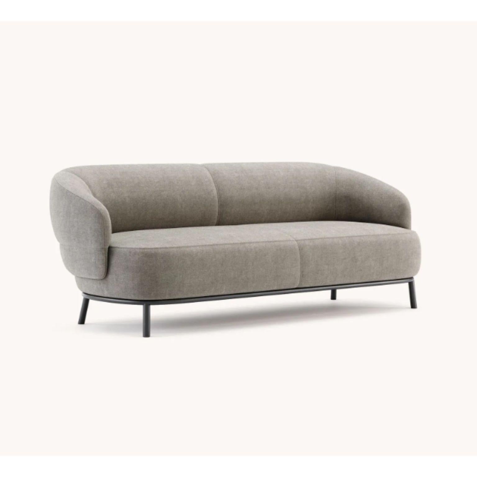 Juliet 2 seats sofa by Domkapa
Materials: black texturized steel, fabric (Logone 01). 
Dimensions: W 202 x D 86 x H 73 cm.
Also available in different materials. 

Inspired by a concept of elegance, comfort, and intimacy, Juliet sofa is a