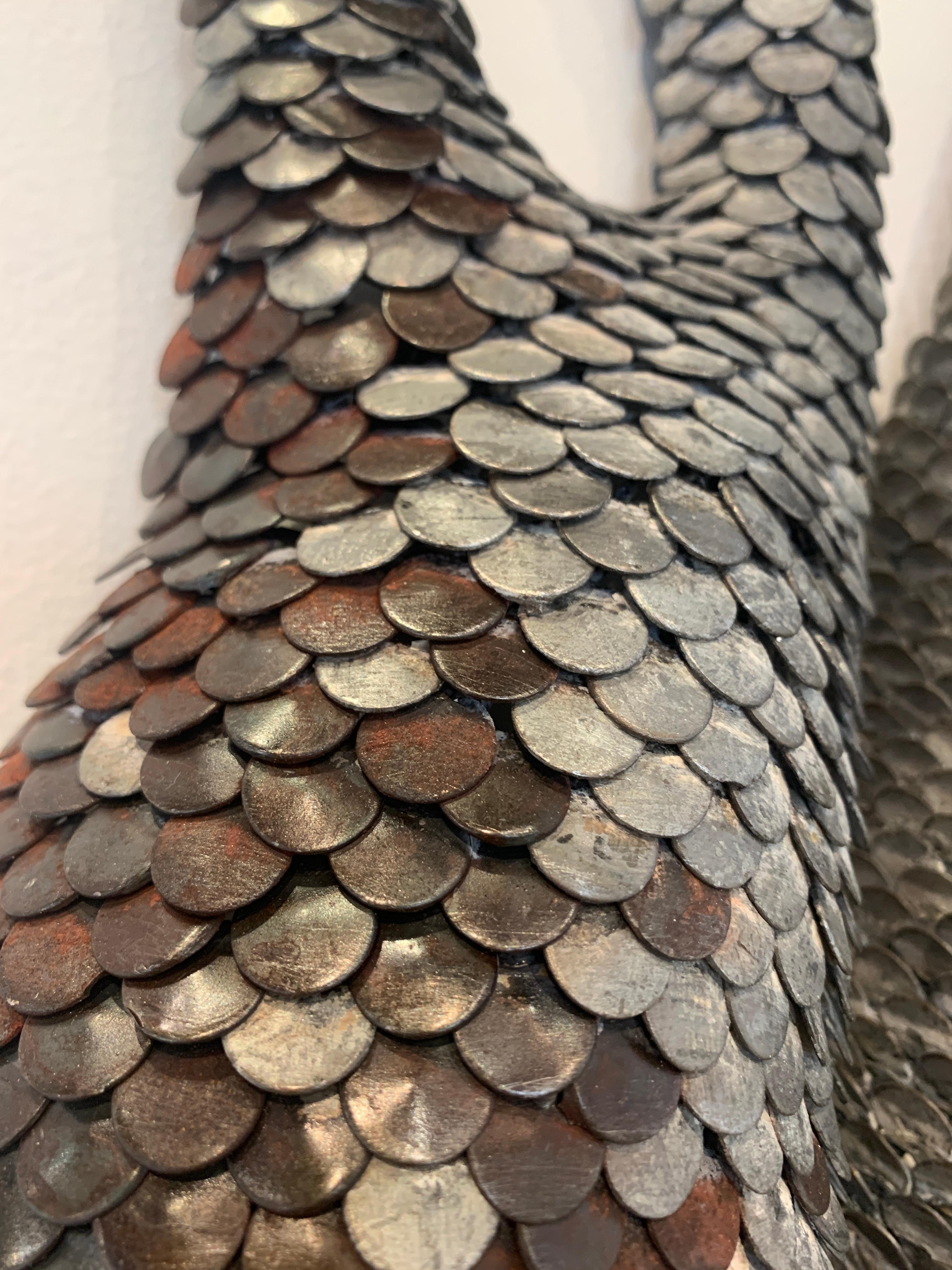 Scultura da parete in metallo 3d con scaglie 