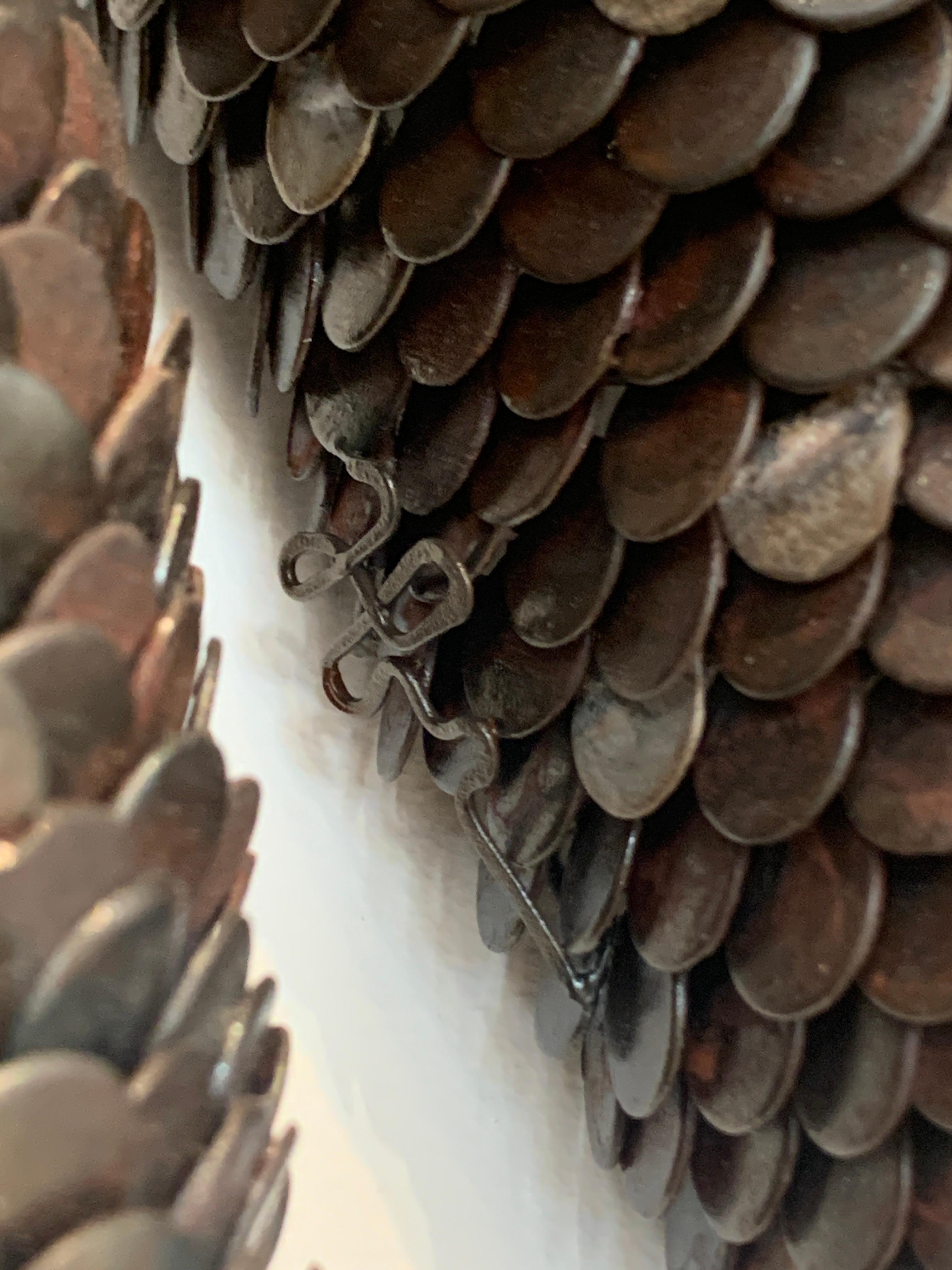 Scultura da parete in metallo 3d con scaglie 