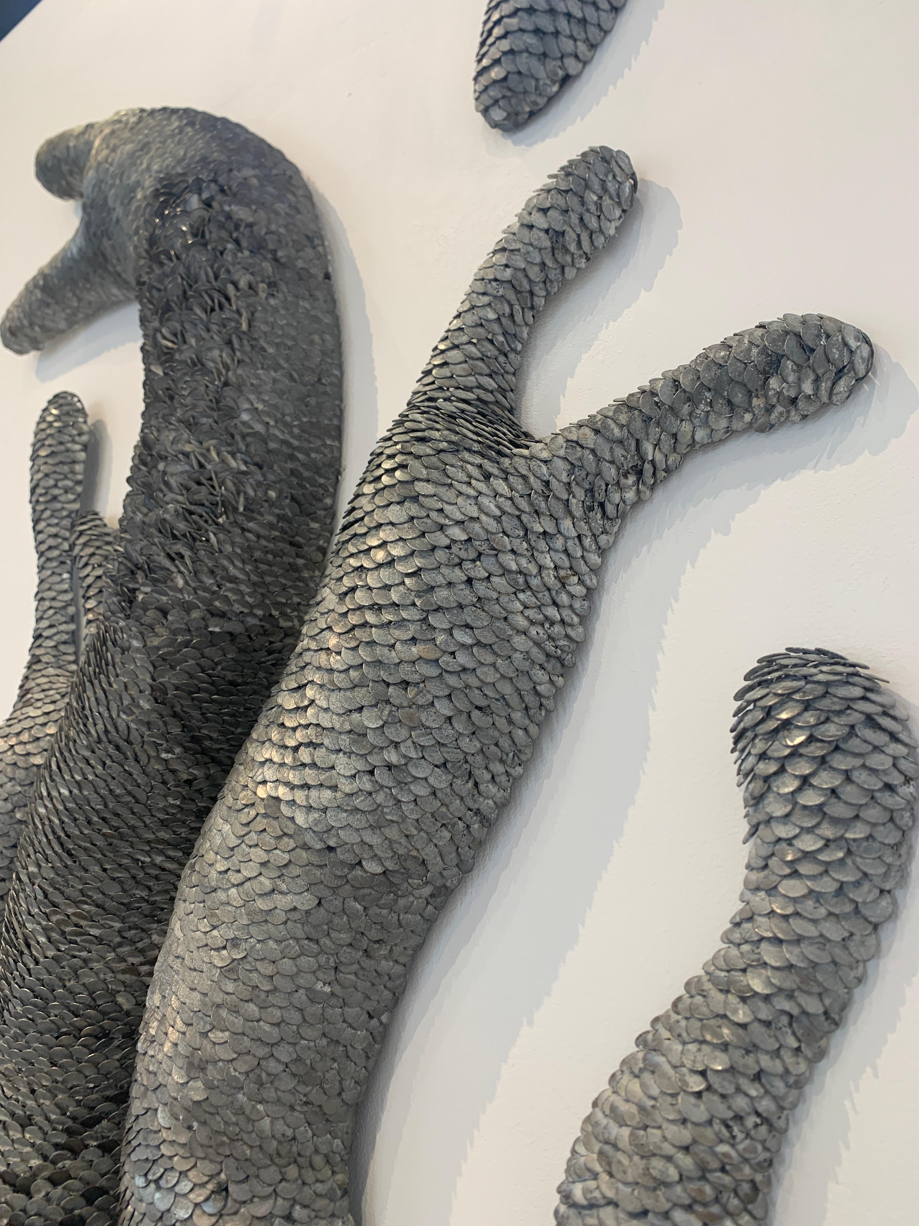 Scultura da parete in metallo 3d con scaglie 