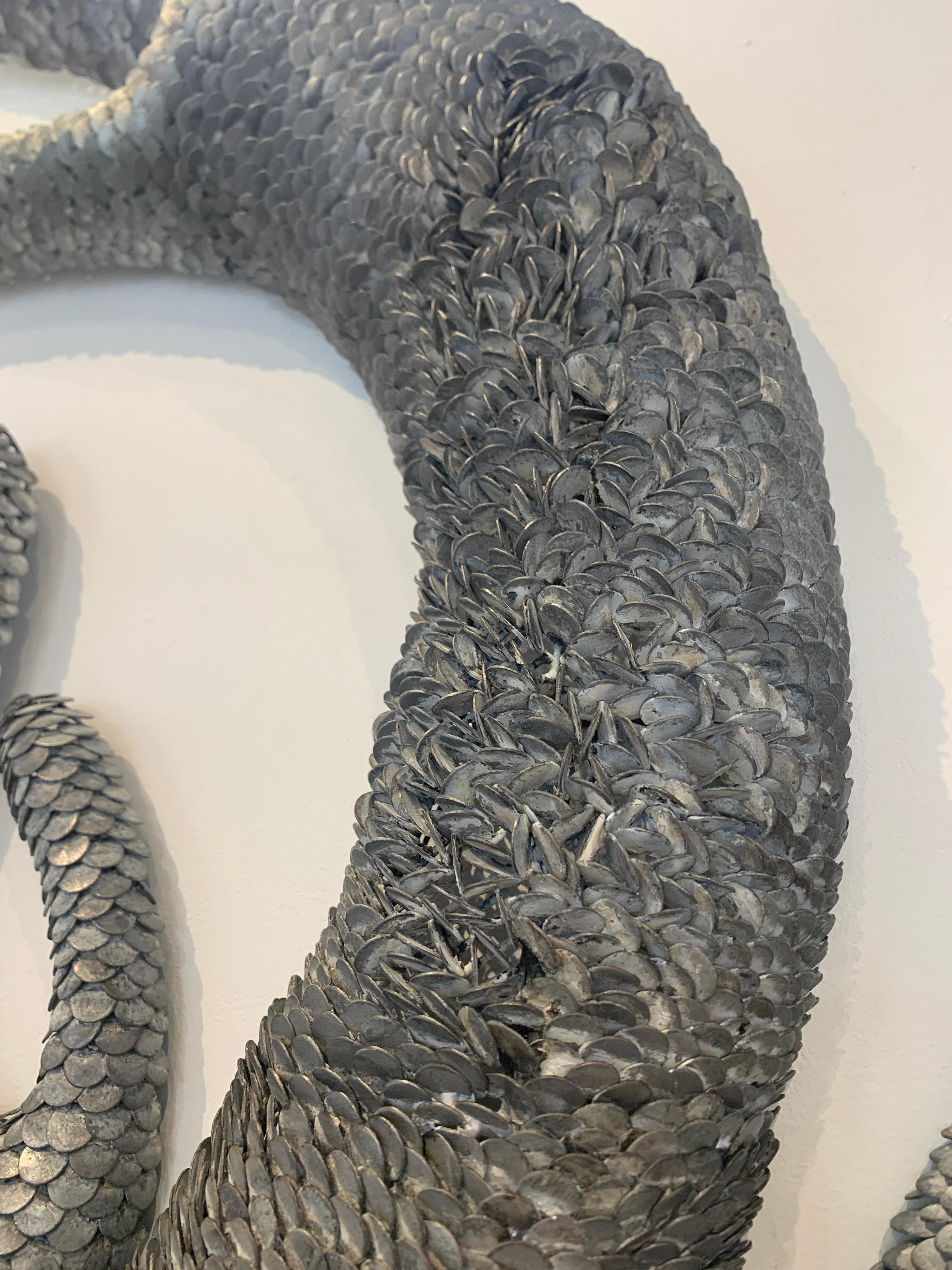Scultura da parete in metallo 3d con scaglie 
