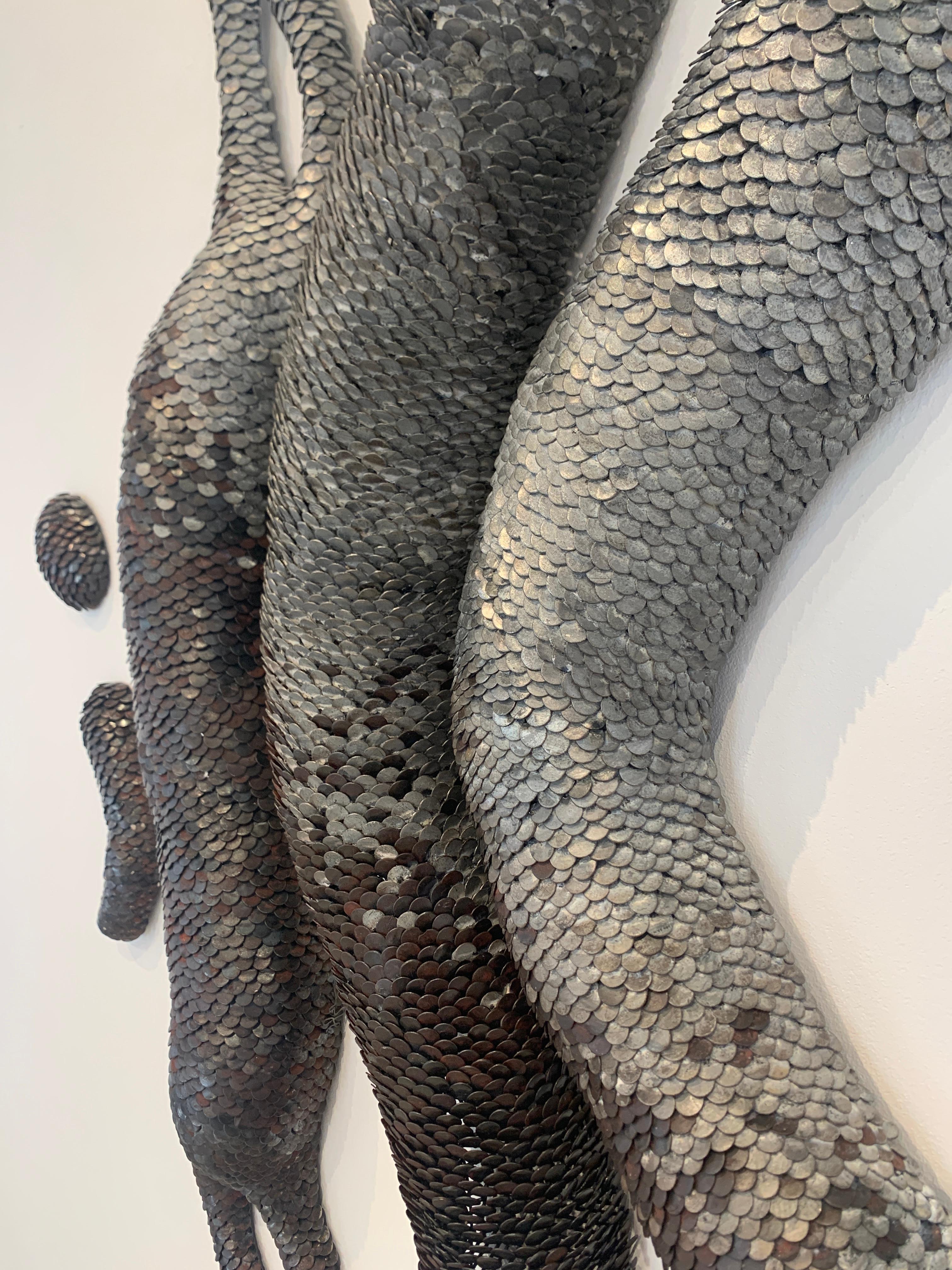 Scultura da parete in metallo 3d con scaglie 