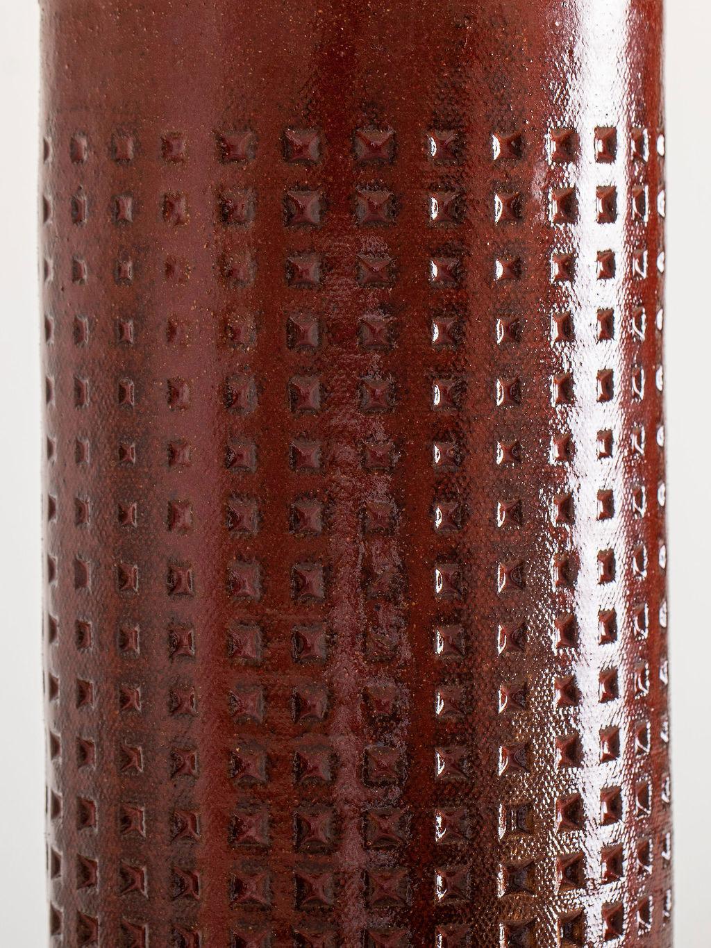 Our stoneware Juliette Lamp is handcrafted using slab-construction techniques. The lamp’s pattern is created by rolling the surface with textured rolling pins and rods.

FINISH

- Carriage Red poured glaze 
- Antique brass fittings
- Black-cloth
