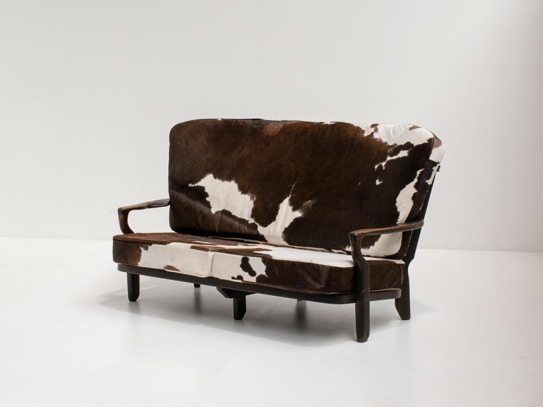 Mid-Century Modern 'Juliette' Sofa by Guillerme et Chambron in Solid Stained Oak and Cowhide, 1950s For Sale
