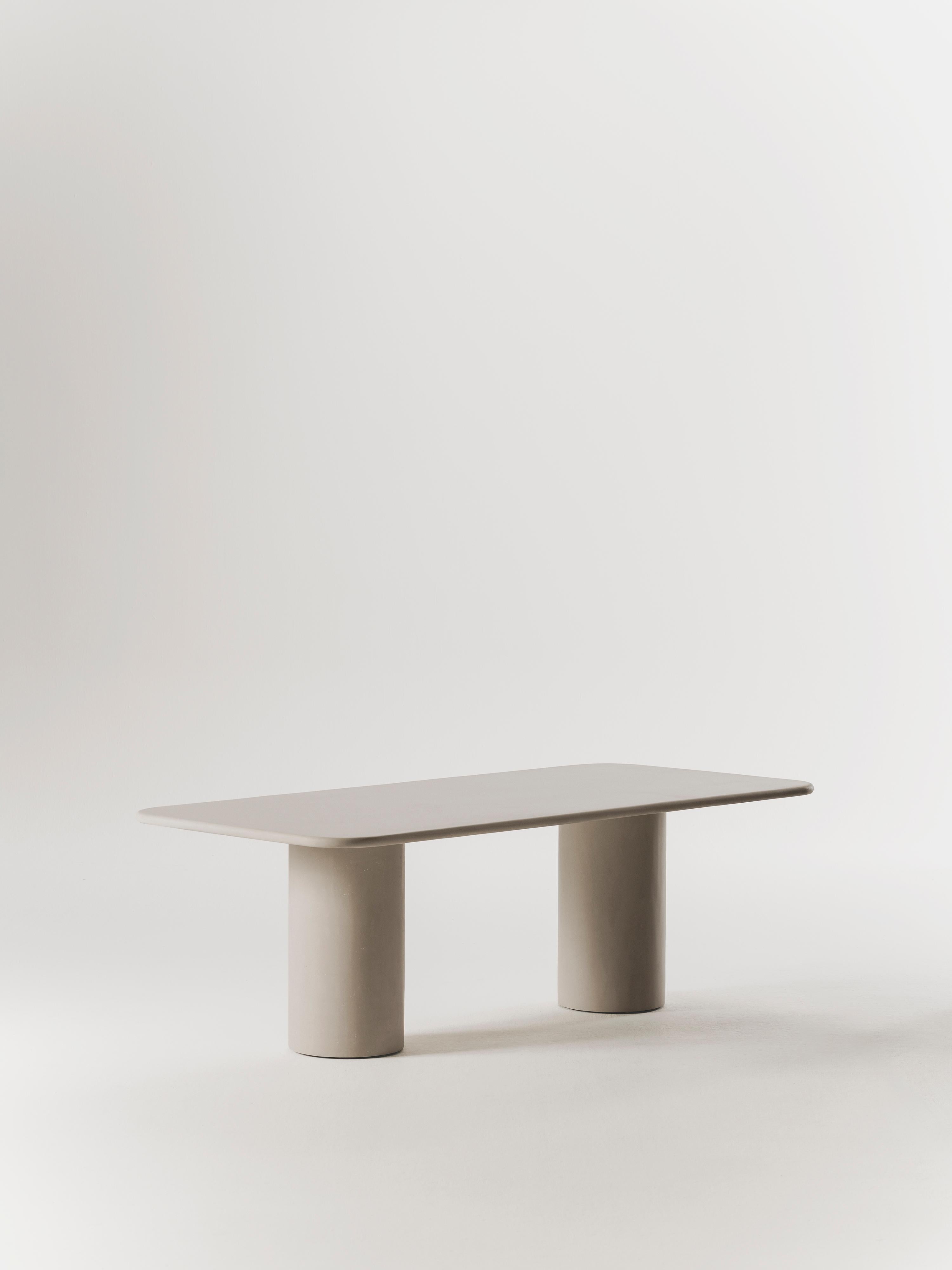 Handcrafted in Spain by expert artisans, this oval-shaped dining table from Marlot Baus combines timeless design with modern craftsmanship. Each piece is carefully made using our signature microcement technique, layered by hand to achieve a smooth,