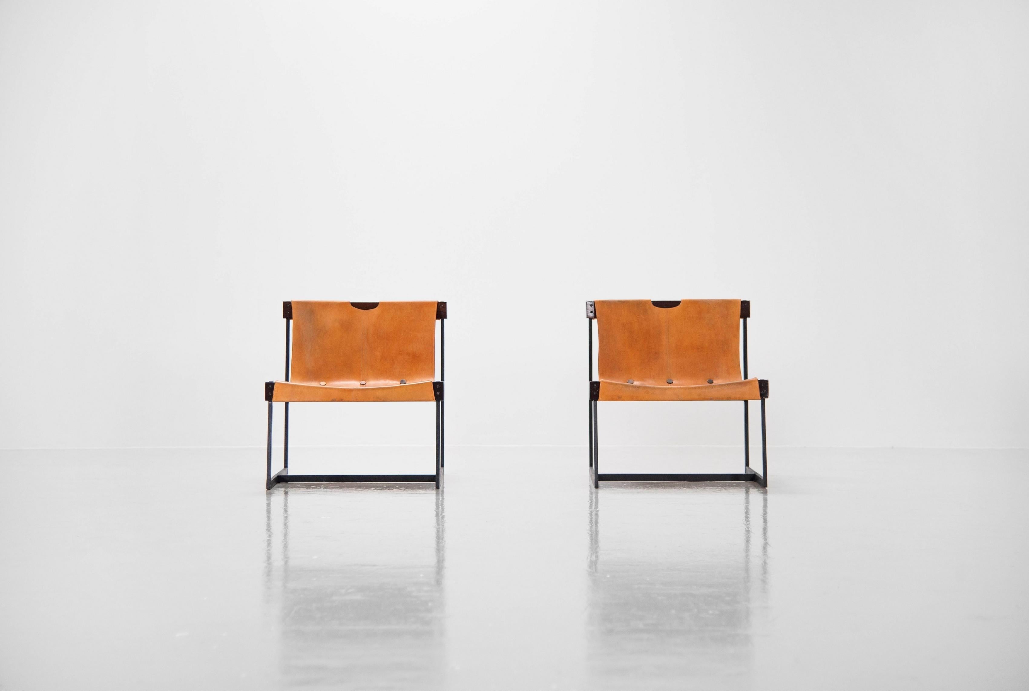Highly beautiful and rare pair of sling chairs designed by Julio Roberto Katinsky, locally made in Brazil 1959. In 1959, to serve a private order from a client, he designed the famous Katinsky armchair, a precious example of modern furniture design