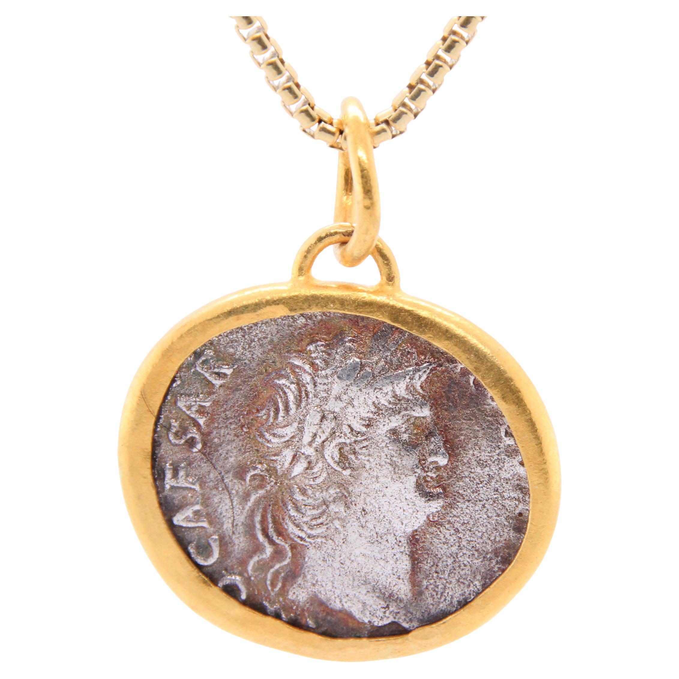 Julius Caeser Coin Replica Pendant, 24K and Silver, Handmade by Prehistoric Works of Istanbul, Turkey. Pendant Details: Coin Replica, Width - 3/8”, Two-sided pendant, 24K Gold Bezel -1.10 grams, Sterling S925 - 2.20 grams. Pendant comes with a 16