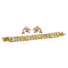 Conjunto de pendientes de delfín con cierre de clip y pulsera de eslabones de Julius Cohen, en oro de 18 quilates, con diamantes de 8,2 ct