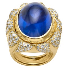 Julius Cohen 1980er Jahre Cocktail-Ring aus 18 Karat Gelbgold mit blauem Saphir und Diamant