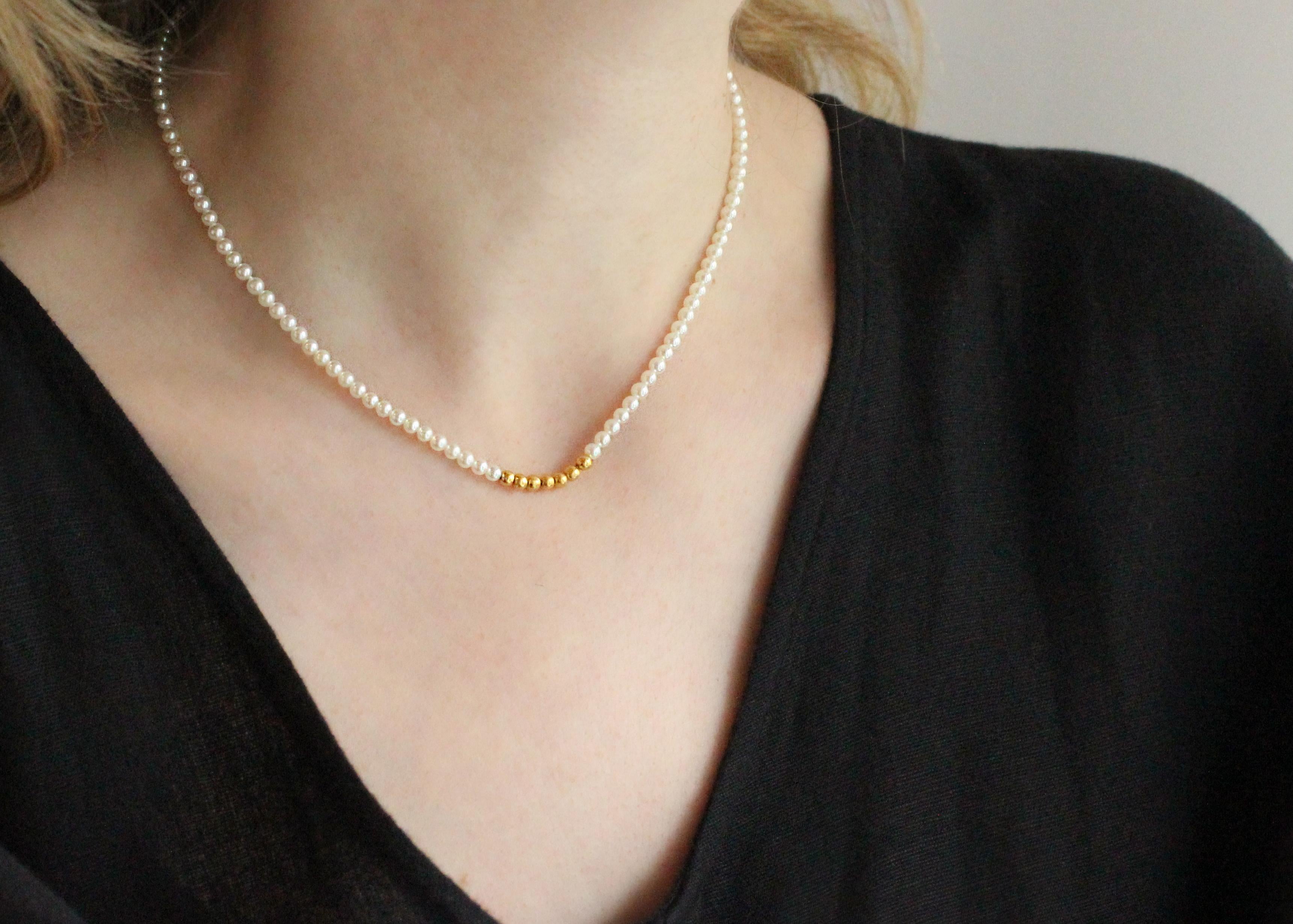 This super sweet necklace contains 111 Cultured Pearls (3-3.5mm) and seven Handmade 24 Kt Gold Beads.  

Necklace is 15 1/2