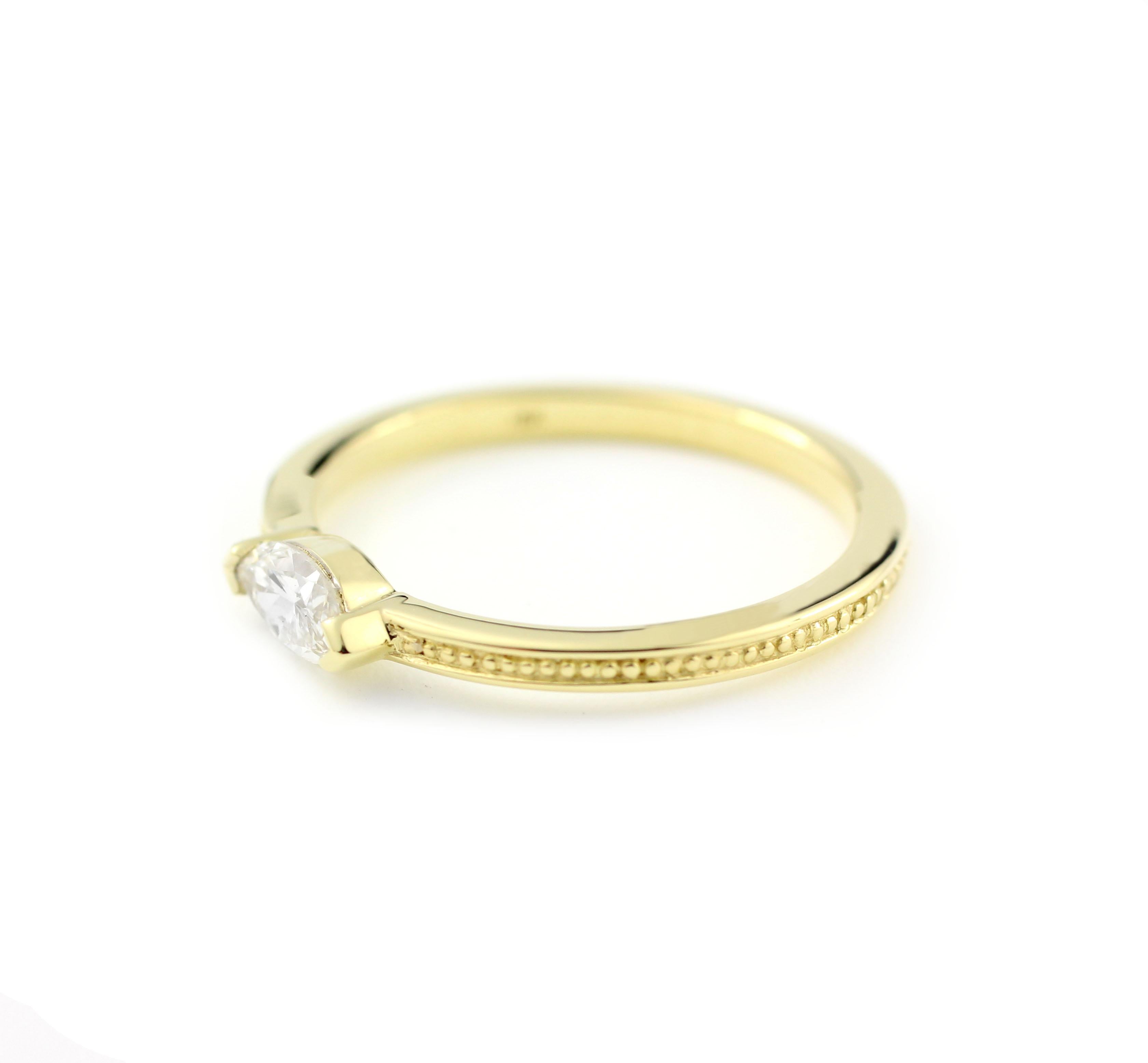 18 Kt Yellow Gold and Marquise Diamond Ring

This ring blends the ancient style of a finely beaded band detail with the modern setting of one Marquise Diamond (.34 Cts.).  The Diamond is clear and bright, measuring 6.7mm x 3.5mm and rated