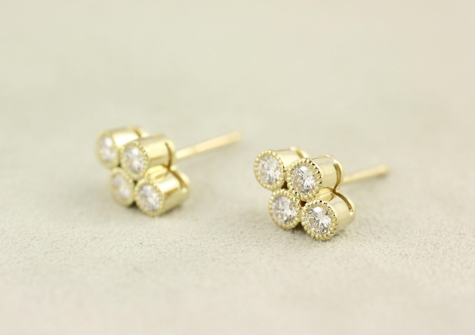 These 18 Kt Yellow Gold and Diamond Stud Earrings contain 8 Brilliant Cut Diamonds (.44 Cts.), bezel set with a milgrain edge detail.  A perennial Julius Cohen favorite, these earrings can also accommodate drops.  Please contact us to inquire about