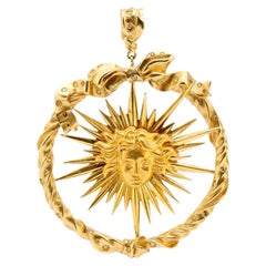 Julius Cohen fancy yellow diamond 18k gold sun pendant