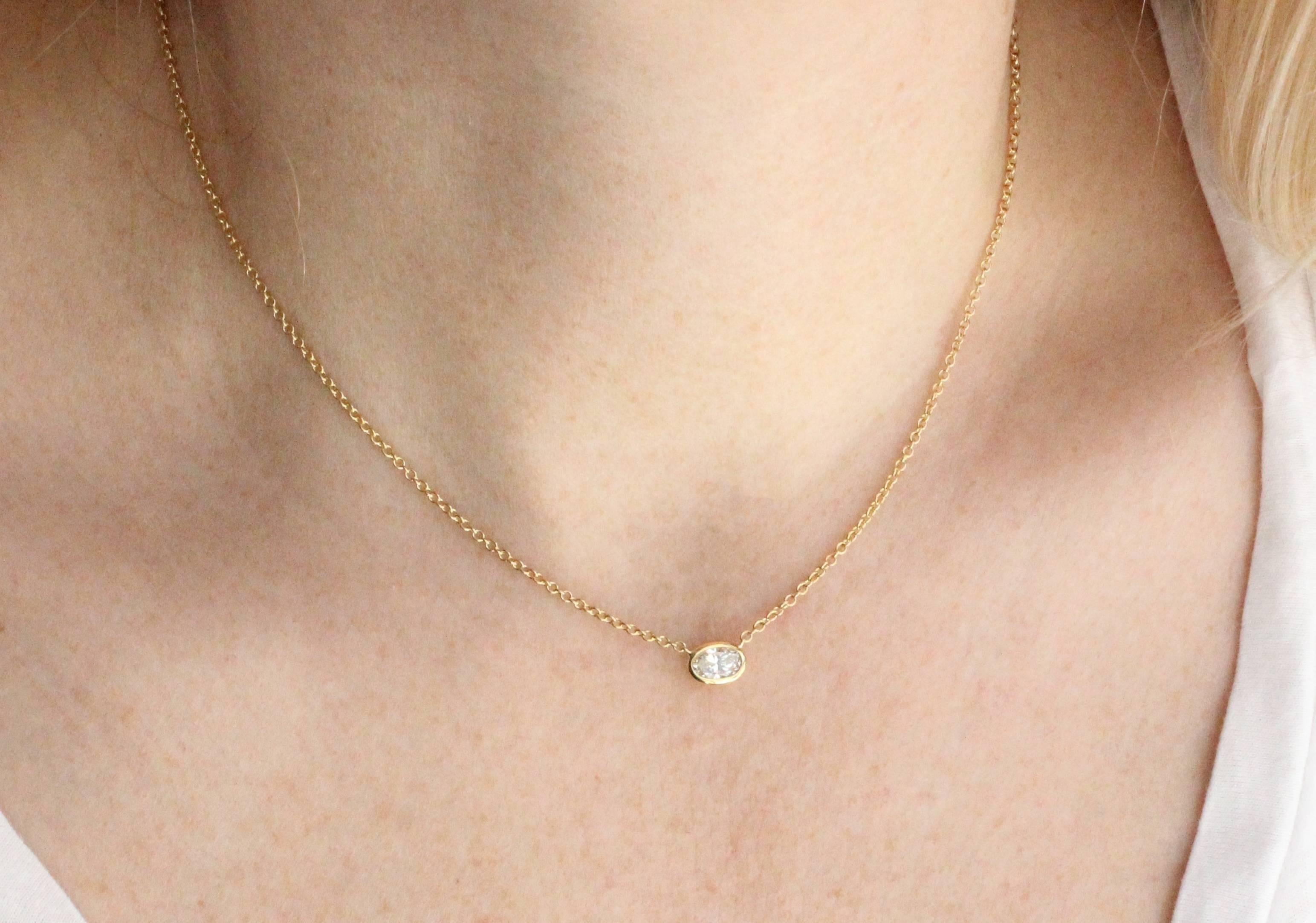 Great everyday diamond necklace features a .60 Cts. Oval Diamond.  The versatile 18 KT Gold chain can be worn at 15