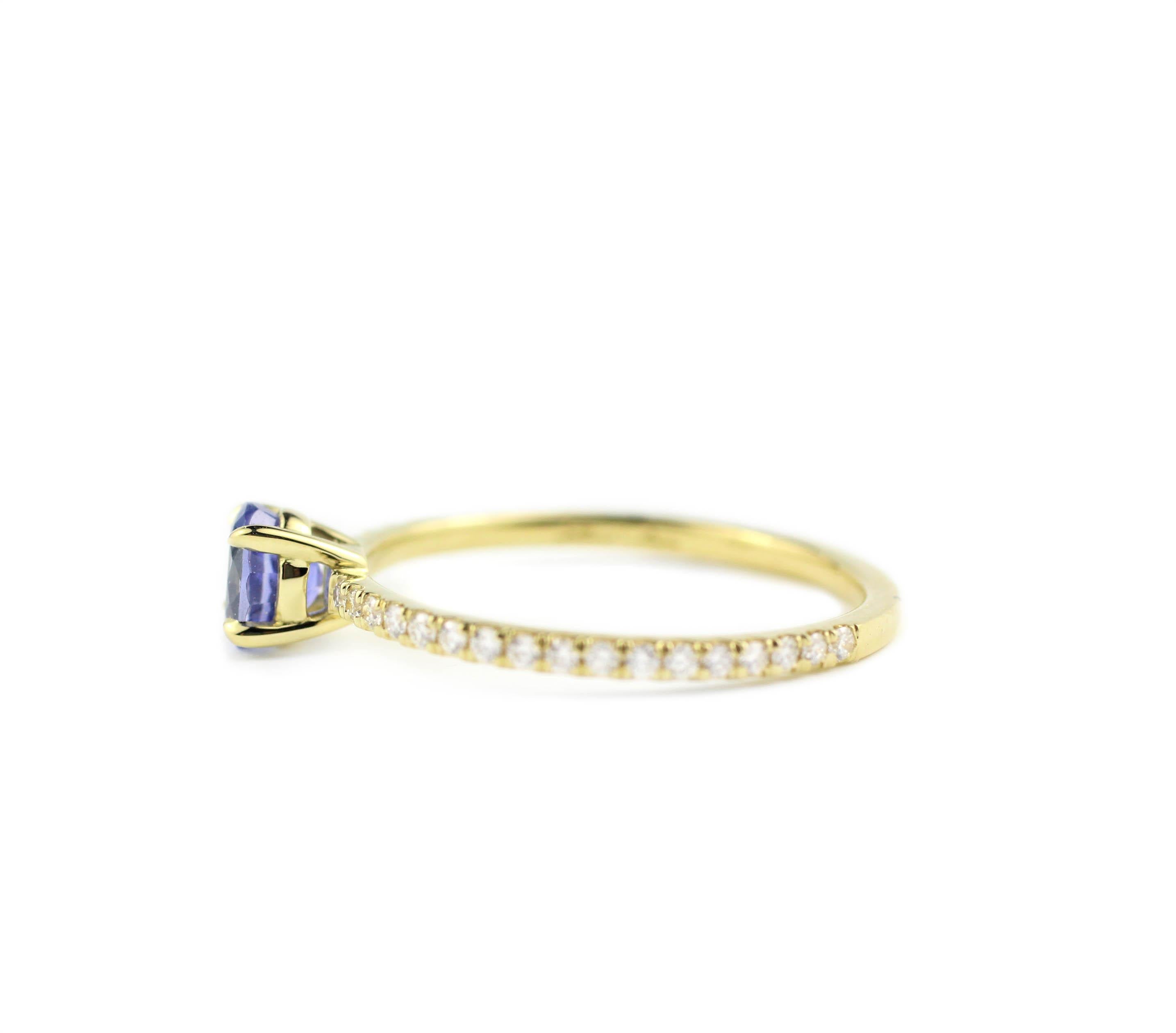 18 Kt Gold, Diamond and Sapphire Ring 

Containing 1 bright, periwinkle Blue Oval Sapphire (.55 Cts.).    The sparkling, cornflower blue stone really makes this ring sing.  The ring shank is set 3/4 around with 34 Brilliant Diamonds (.11 Cts.)
In