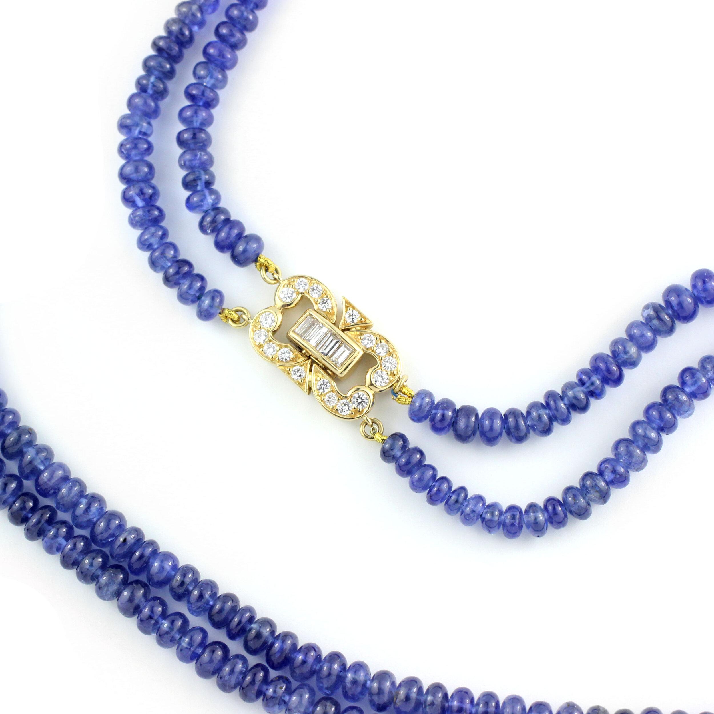 Cabochon Sapphire Bead Necklace with 18Kt Gold & Diamond Clasp

Containing 293 beautiful blue Nested Sapphire Beads (170.74 Cts.) with a classic 18 Kt Gold and brilliant Diamond Clasp (22 diamonds, .58 Cts.).  16” Long.

Made in New York.