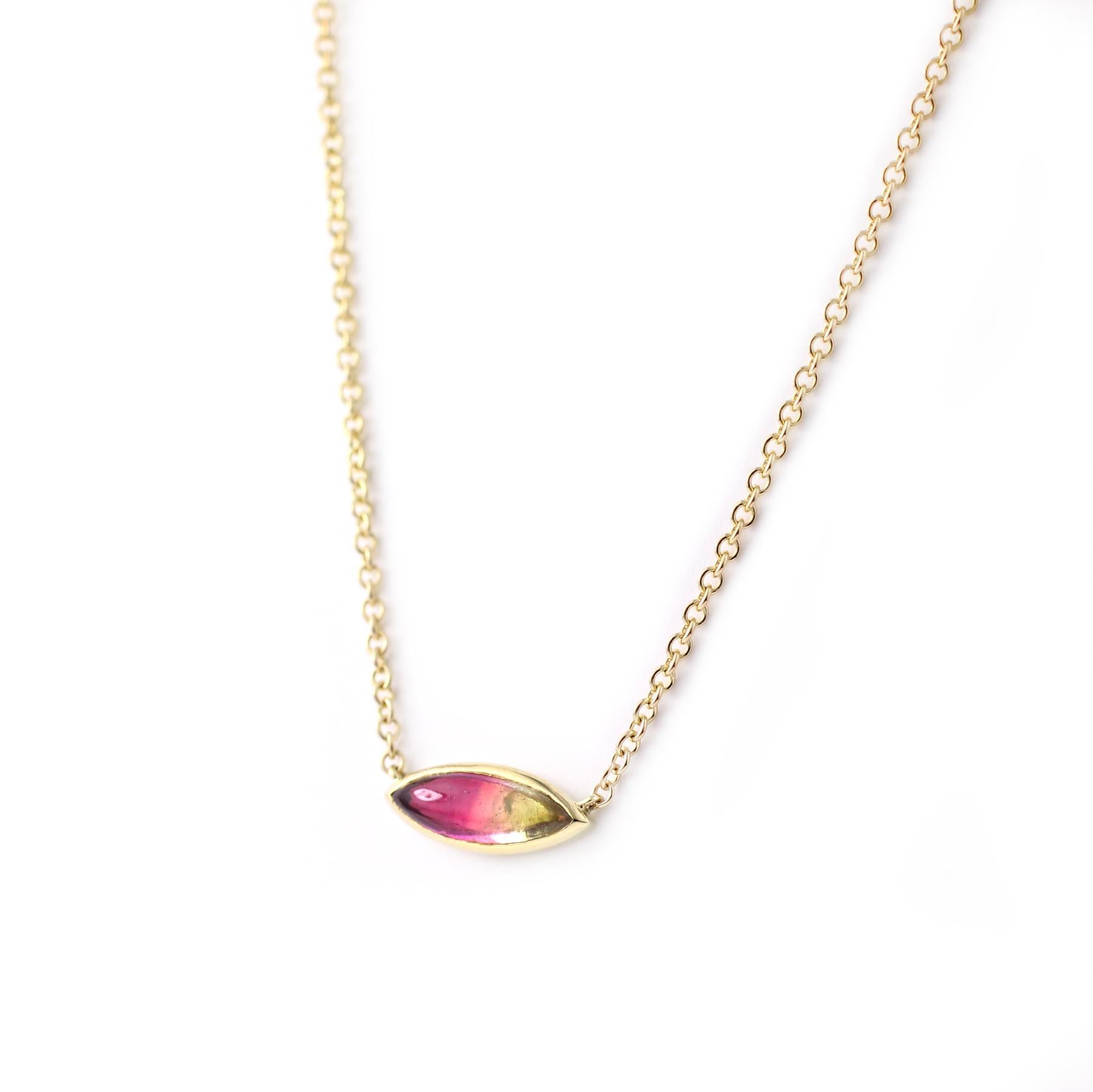 One of a Kind 18 Kt Gold and Watermelon Tourmaline Necklace 

Watermelon Tourmalines have a natural gradient that goes from Pink to Green, making it quite the charming stone.  This juicy marquise-shaped cabochon is set in an 18 Kt Gold bezel and