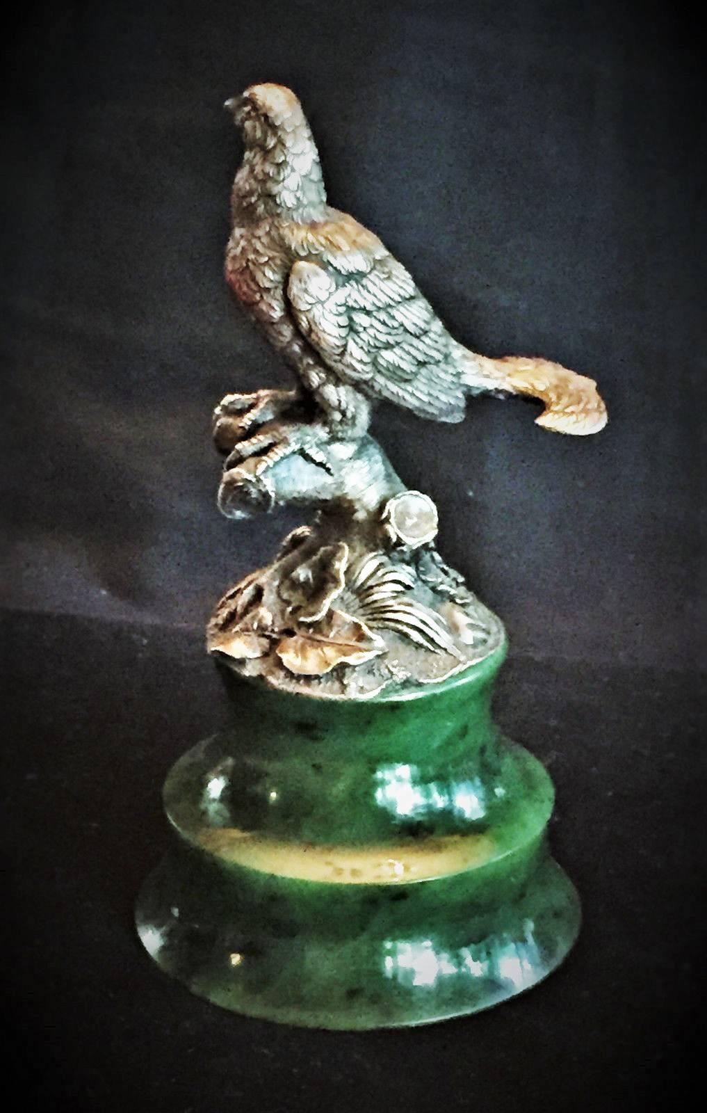 Workmaster Julius Rappoport for Karl Faberge, St Petersburg, circa 1900

Figural silver paper weight in form of a naturalistic cast male Black game, or Black grouse with its unique lyre-shaped tail, on the round nephrite base. 
 
Marked in Cyrillic