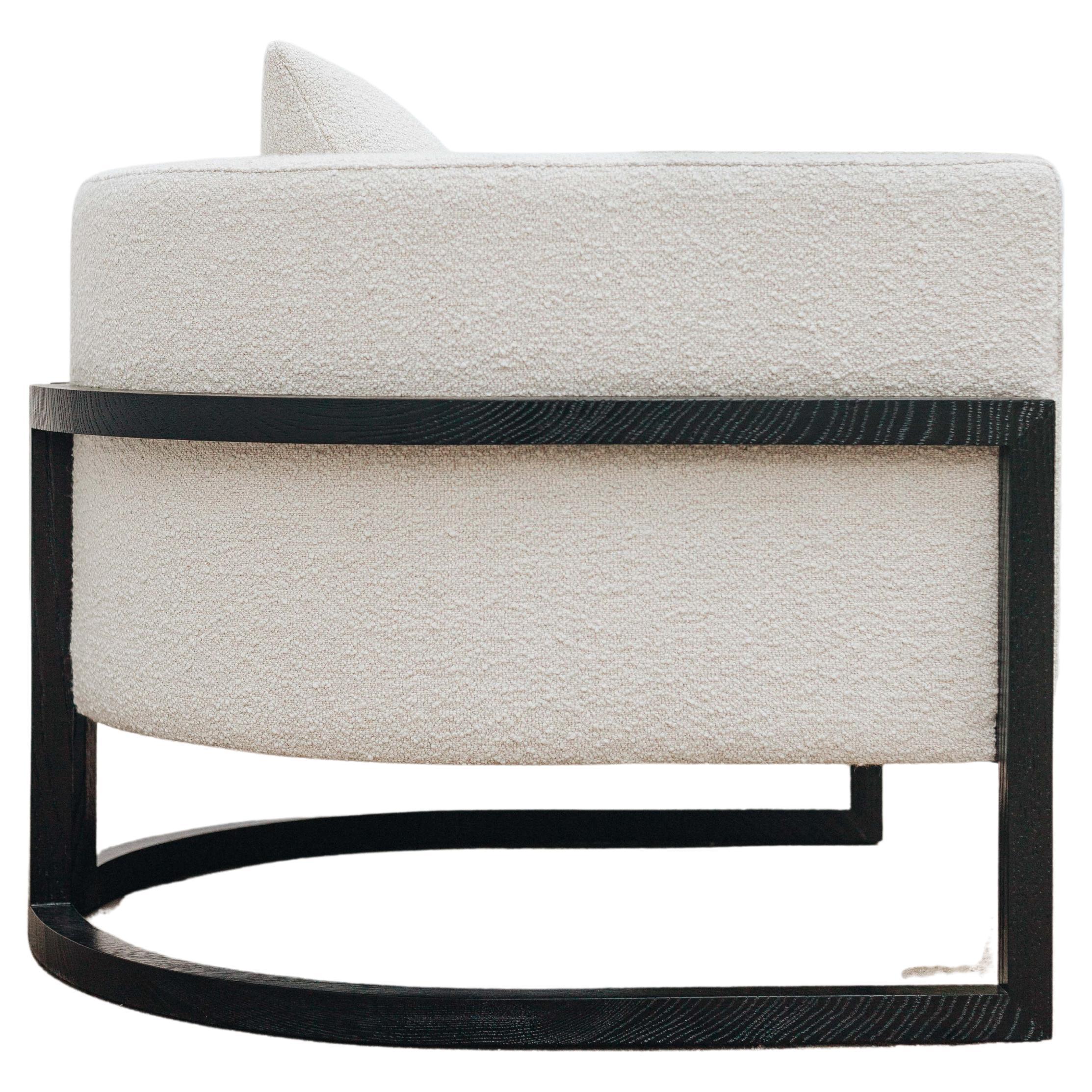 The Julius wood armchair gives us clean and modern lines always with a strong craftmanship presence like the wood that embraces and supports the padding. Constructed with a webbed seat and back and high-density foam. 

Shown in darkened sycamore